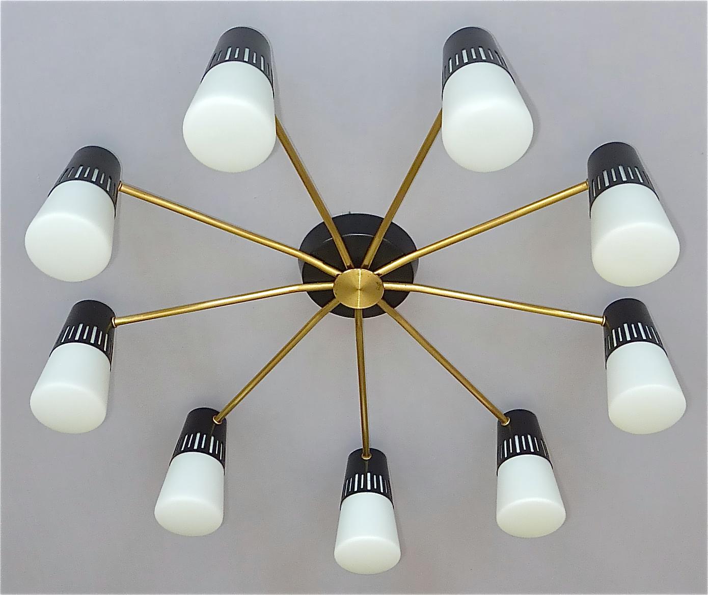Large midcentury 9-light sputnik flush mount or ceiling chandelier with attribution to Stilnovo or Arteluce, Italy circa 1950s and very in the style of Mathieu Mategot. The stylish patinated brass ceiling lamp with black enameled metal base and