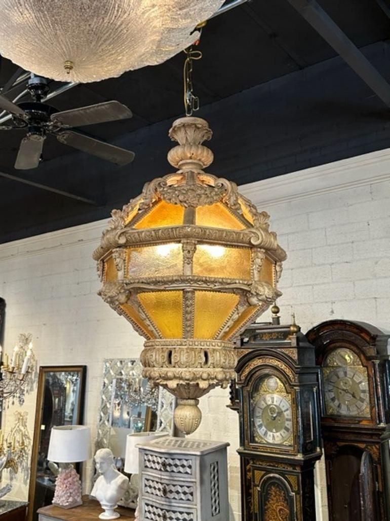 Large scale 19th century Italian carved and stripped wood lantern. circa 1880. The chandelier has been professionally rewired, comes with matching chain and canopy. It is ready to hang!