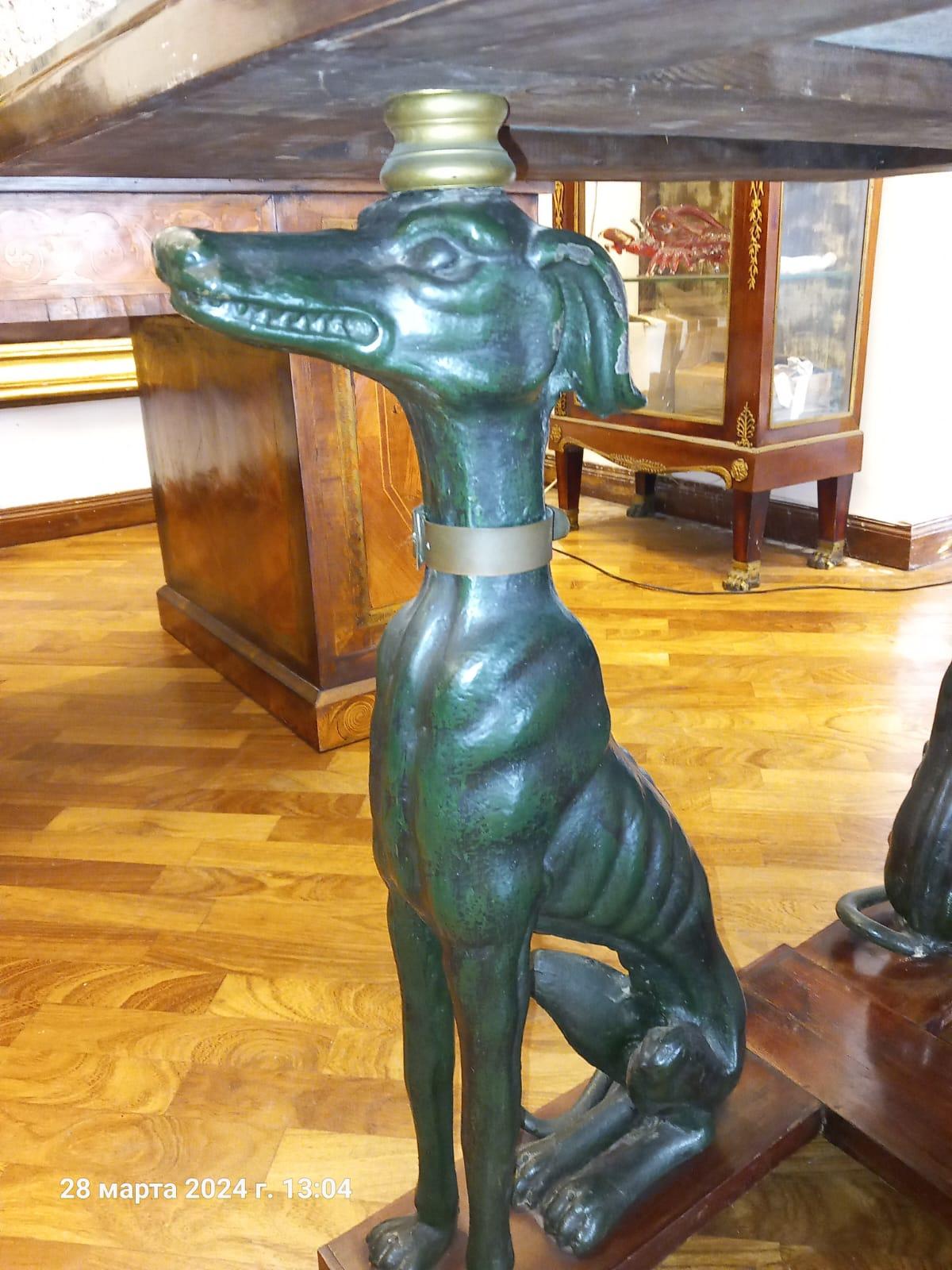 This impressive early 20th-century Italian table, originating from Naples, is a striking combination of craftsmanship and whimsical design. The solid wood structure is complemented by four green-painted cast iron dogs that serve as unique and