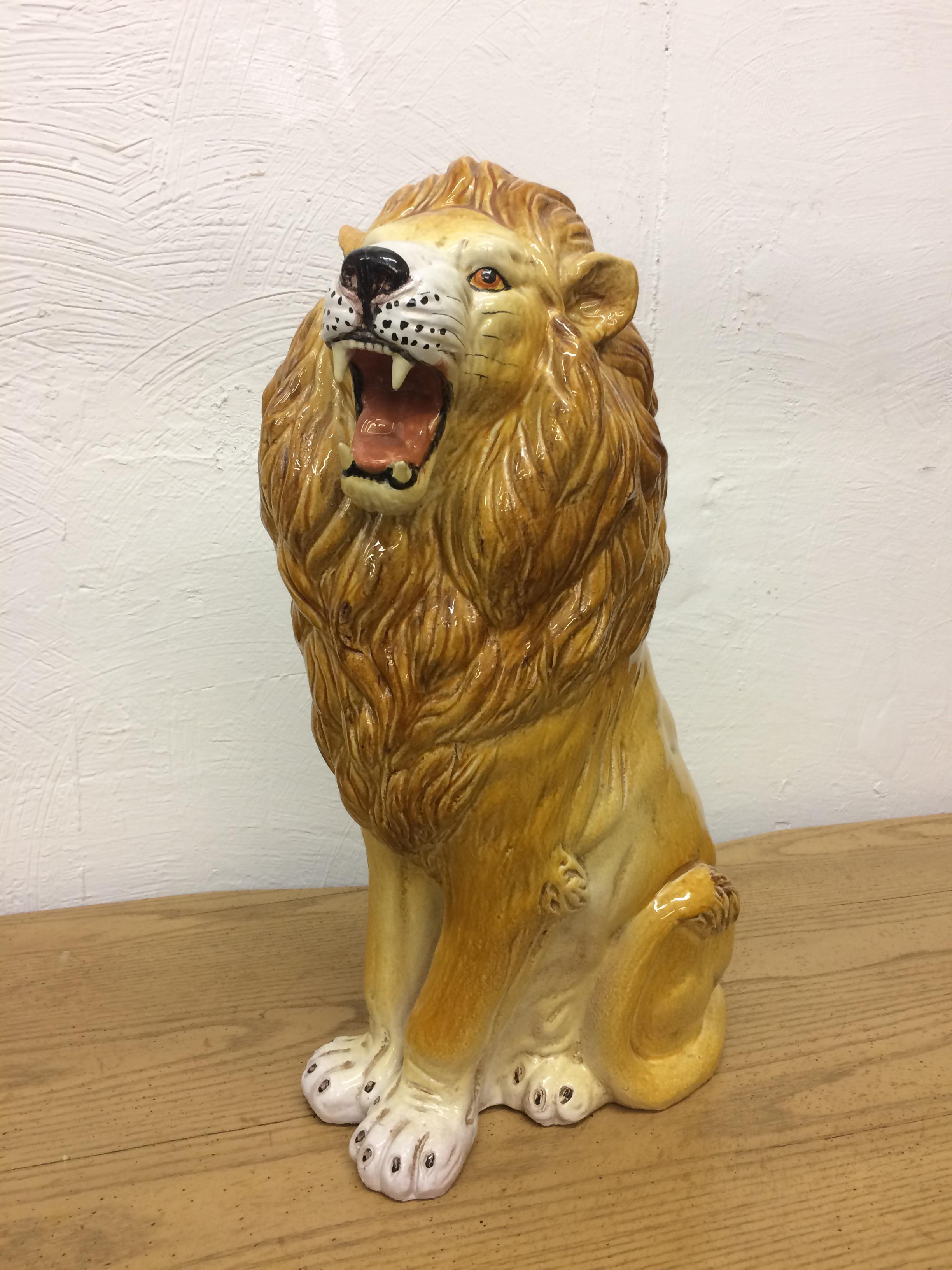 Glazed terra cotta large roaring lion. Marked made in Italy. In very good condition with no damage.
Measures: 26 inches high by 15 wide by 9 inches deep.