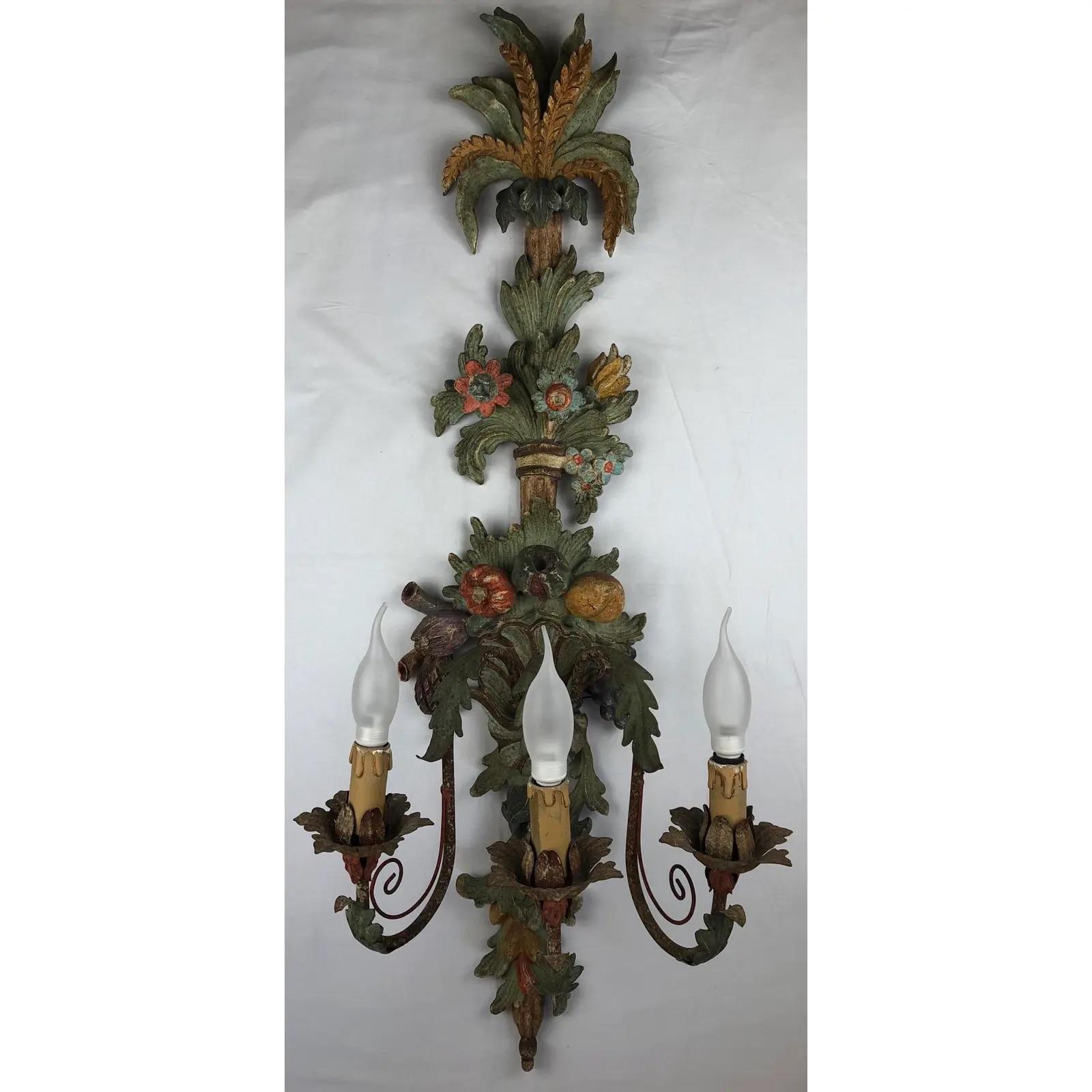 Beautiful sconce, with remarkable floral and foliage designs and details. The wooden sconce is hand carved and probably dates from the 1930s-1940s.

Measures: 39 3/4
