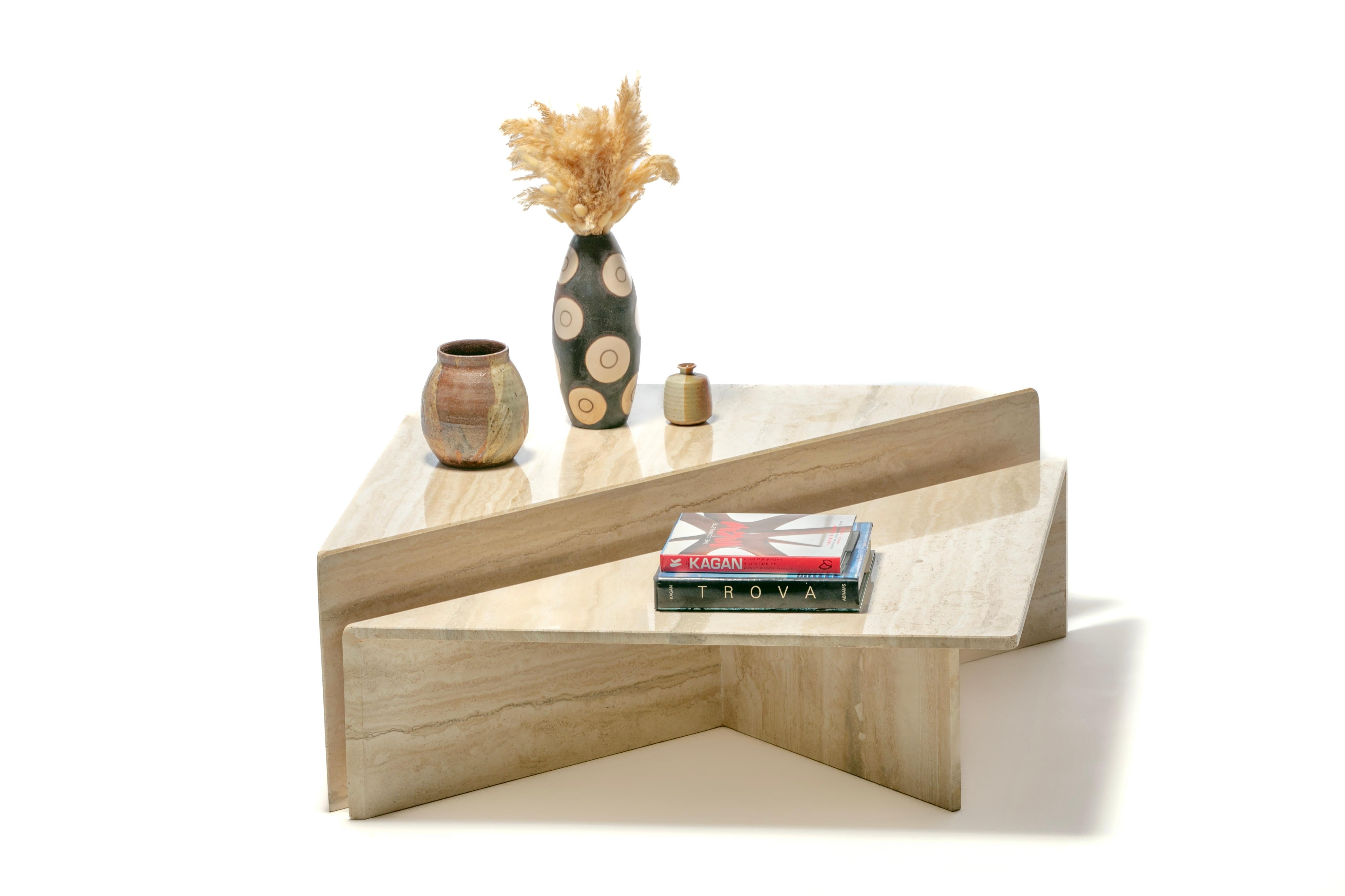 Gorgeous Italian sculptural two part modern travertine coffee tables hailing from the 1970s. Neutral. Versatile. This particular set showcases an especially beautiful travertine grain that offers a stronger contrast. The grain gently softens the