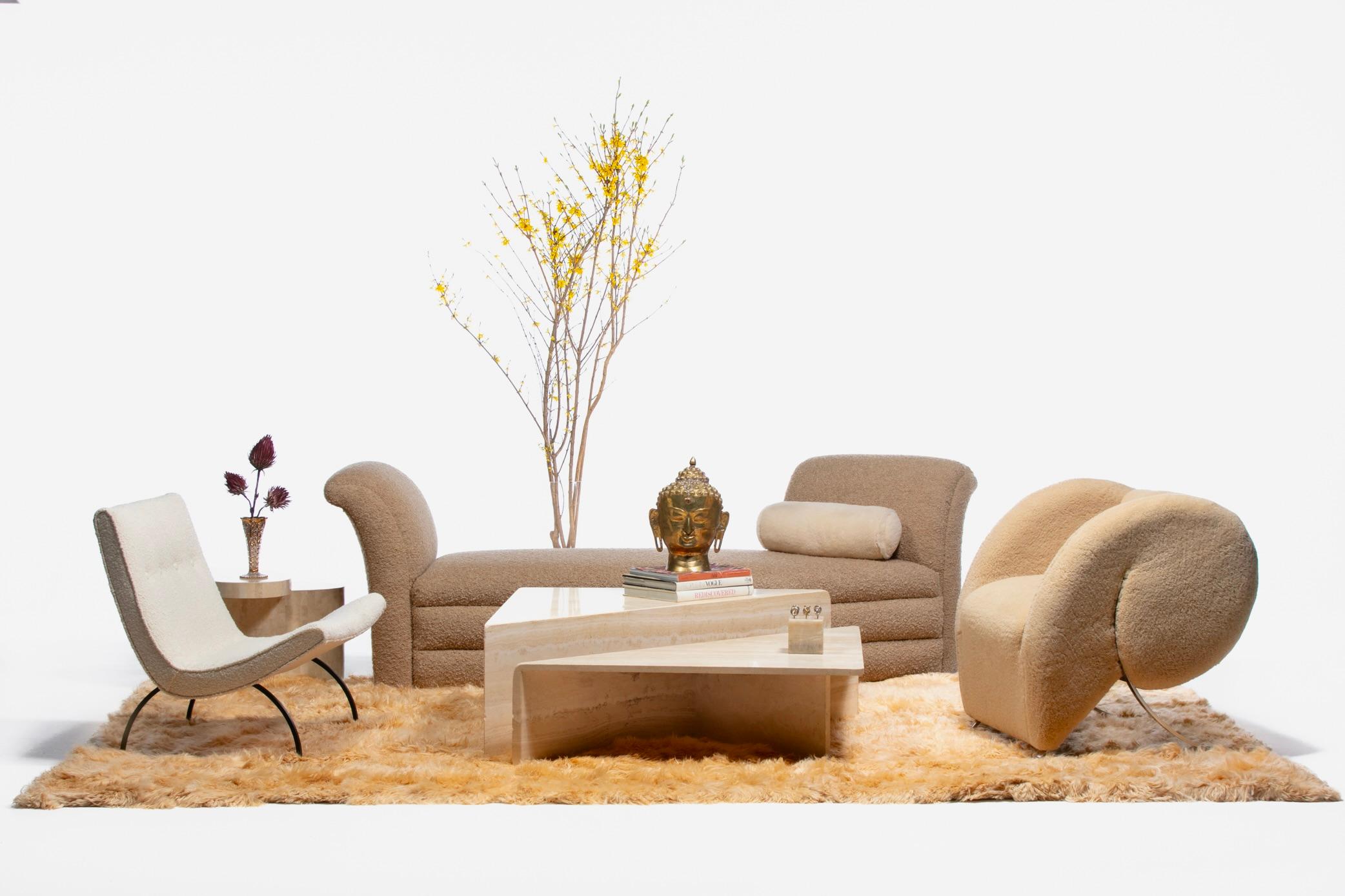 Gorgeous Italian sculptural two part modern travertine coffee tables hailing from the 1970s. Neutral. Versatile. This particular set showcases an especially beautiful travertine grain that offers a stronger contrast. The grain gently softens the