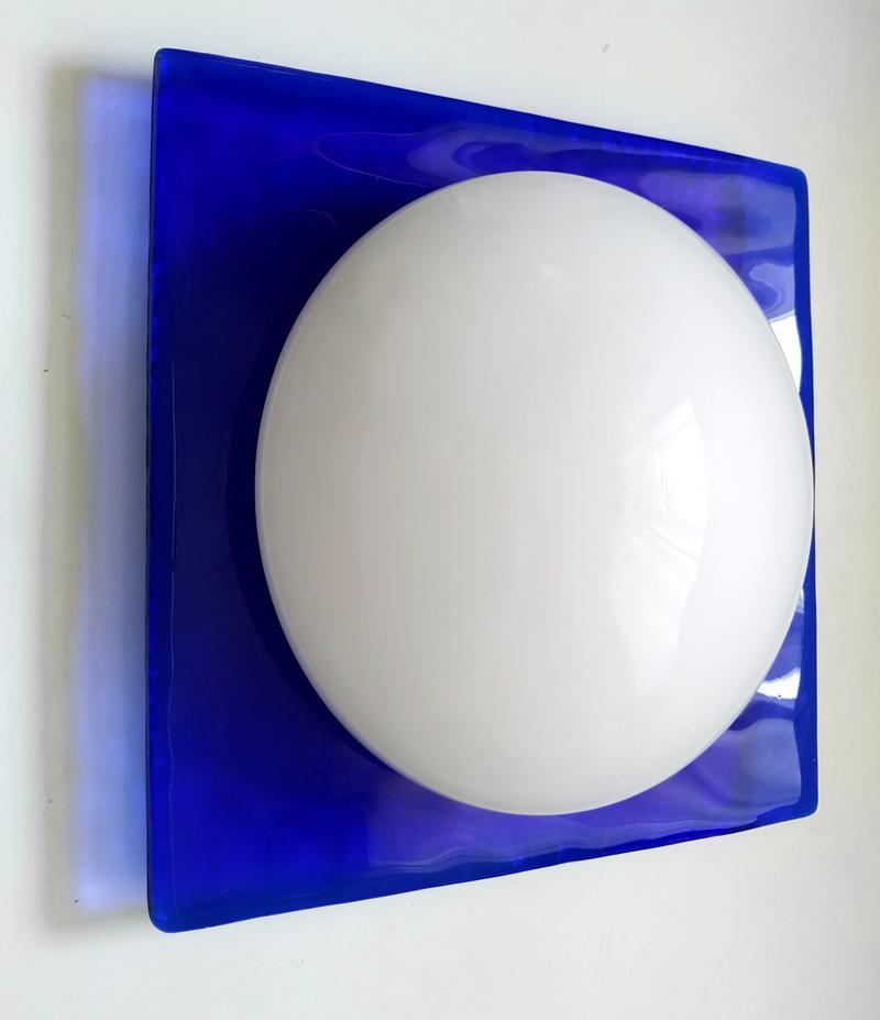 One vintage Space Age hand blown round opal white and square textured (blue or green) glass wall or ceiling flush mount.
Italy, 1970s-1980s.
Lamp socket: One E27 (US E26).
Available: 6x Blue, 4x Green, 1x Clear