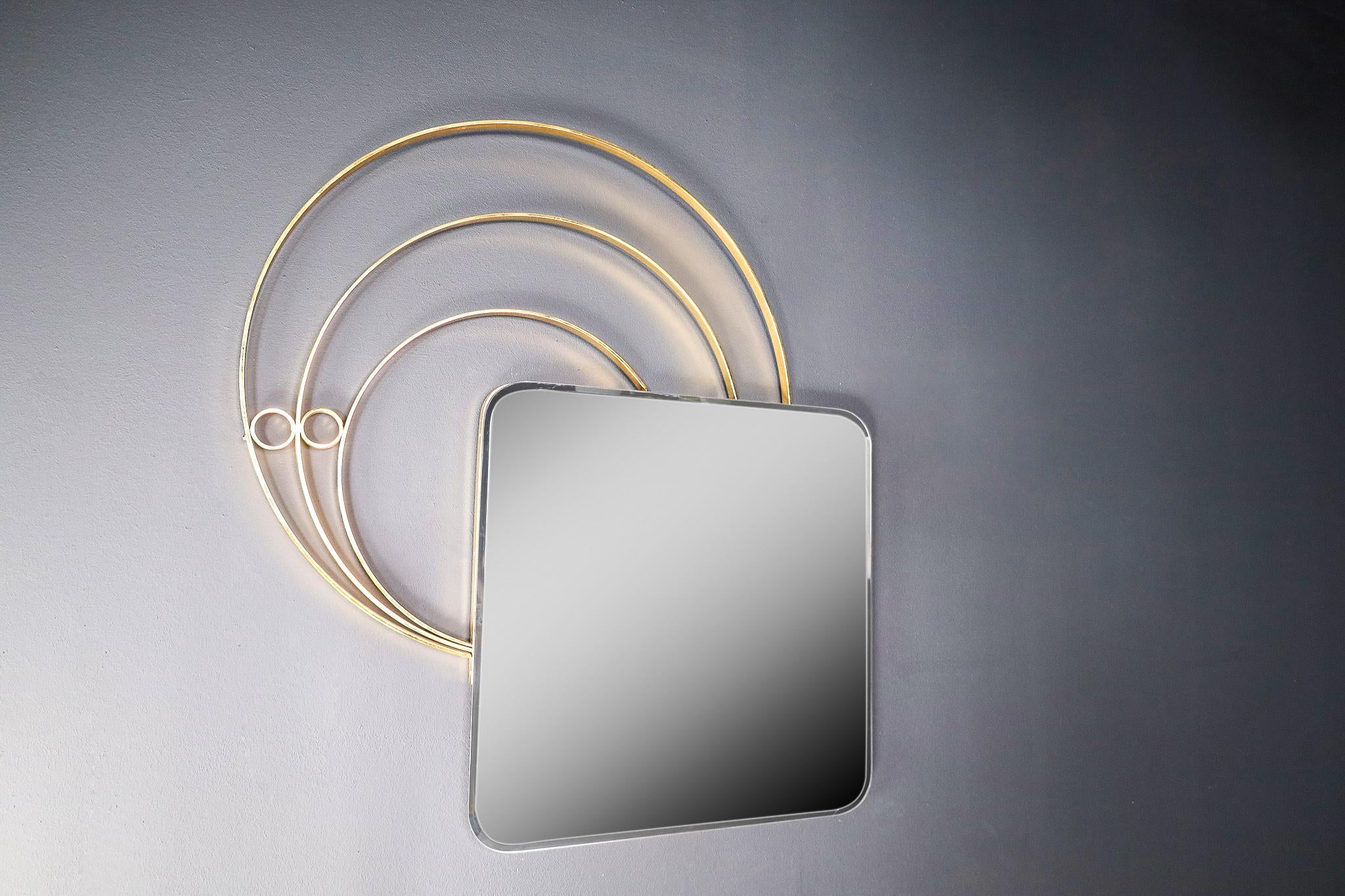 Large Italian Wall Mirror in Brass by Luciano Frigerio, Italy 1960s

Luciano Frigerio is an Italian designer well active in the 1960s-70s. He designed elegant furniture in a brutalist chic style. The quality of his creations is quite excellent.