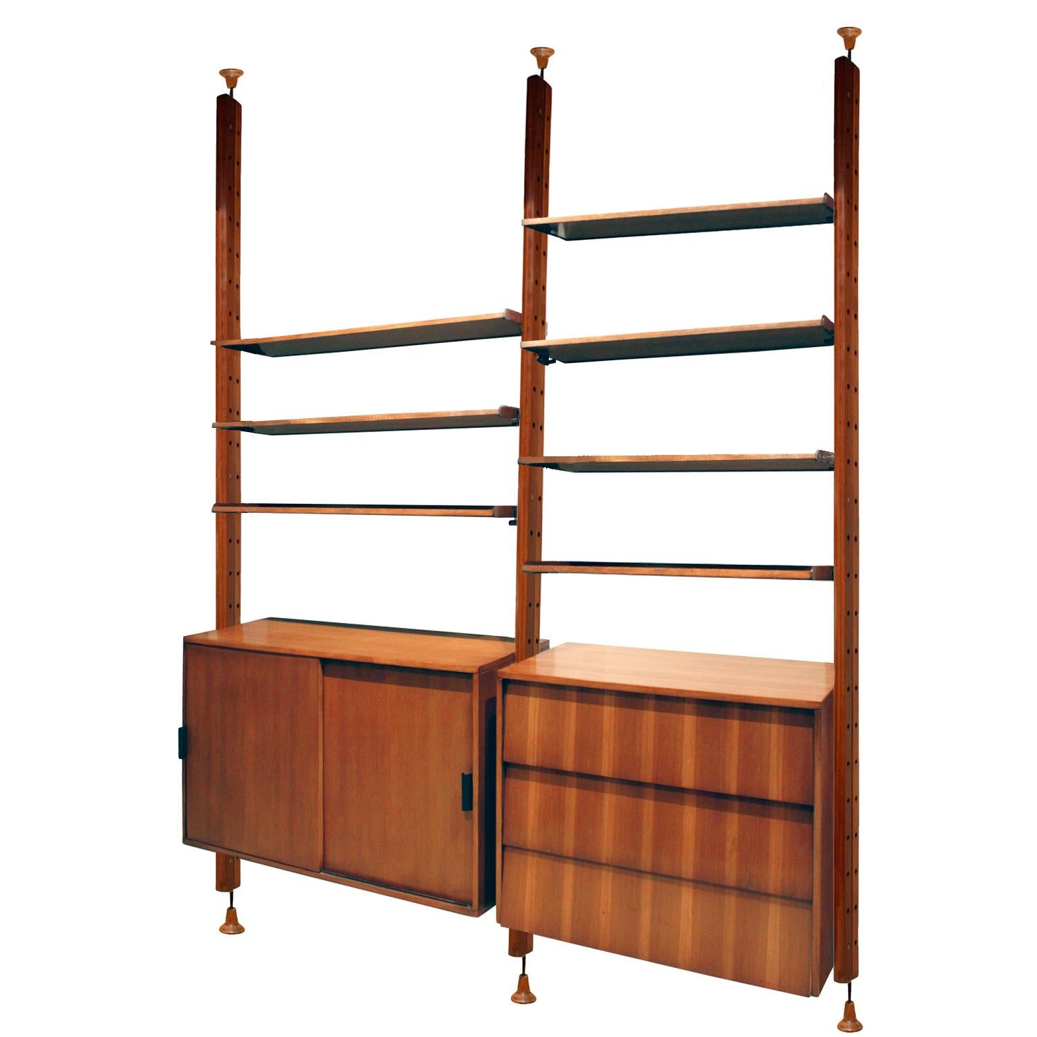 Wall unit with adjustable shelving system, cabinet, chest and flip top desk in rosewood, teak and mahogany by I.S.A., Italian 1964 (label on desk that reads, “ISA Bergamo Italy”). This wall unit is very versatile and beautifully made.