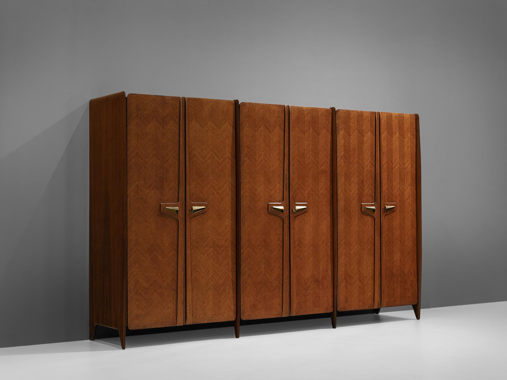 Large Italian wardrobe, walnut, brass, mirrored glass, Italy, 1950s

Gorgeous wardrobe or large cabinet designed in Italy in the 1950s. The overall glamorous feel of this wardrobe is overwhelming. With many beautiful details this piece definitely