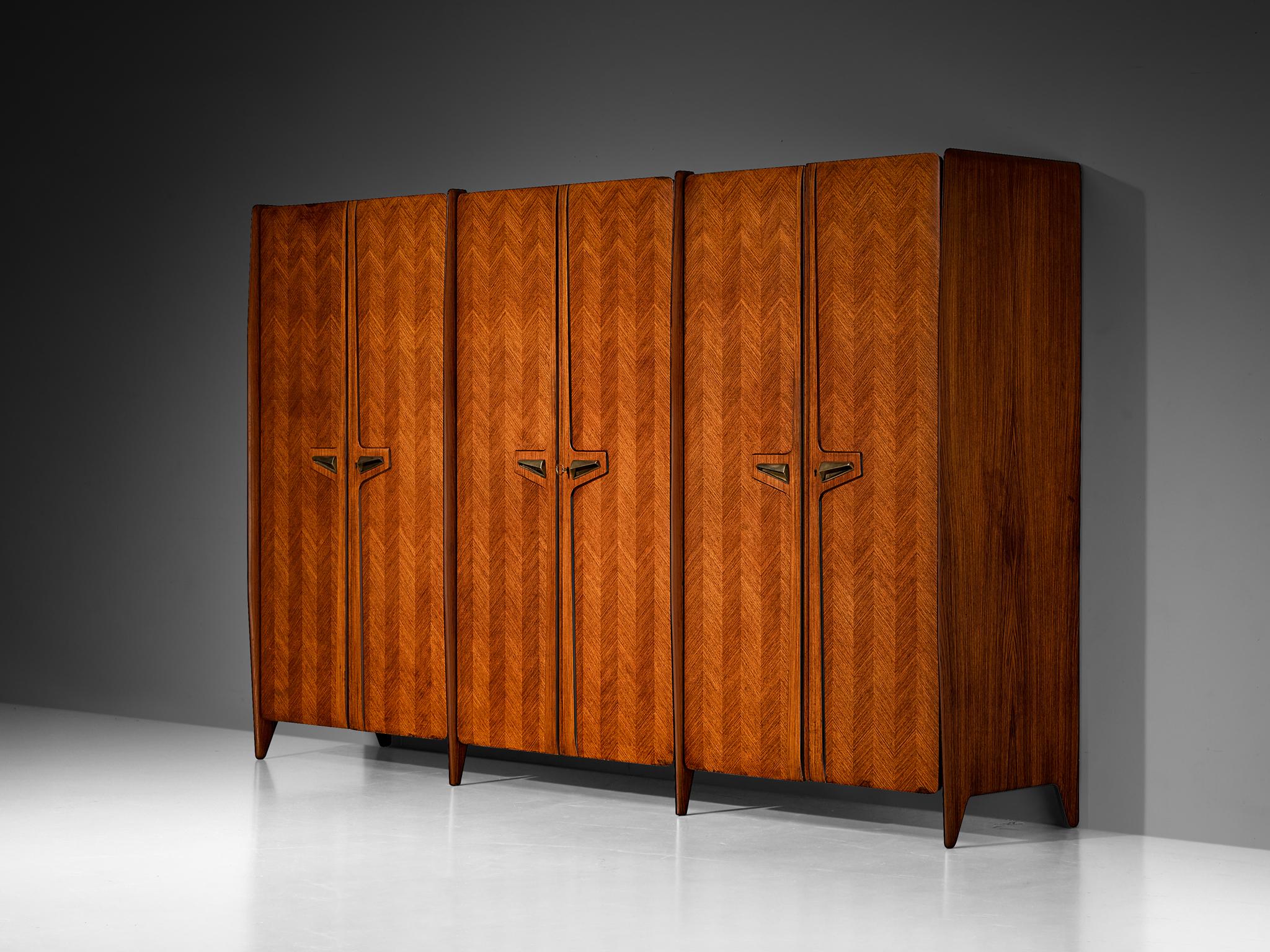 Large Italian wardrobe, walnut, brass, mirrored glass, Italy, 1950s

Gorgeous wardrobe or large cabinet designed in Italy in the 1950s. The overall glamorous feel of this wardrobe is overwhelming. With many beautiful details this piece definitely