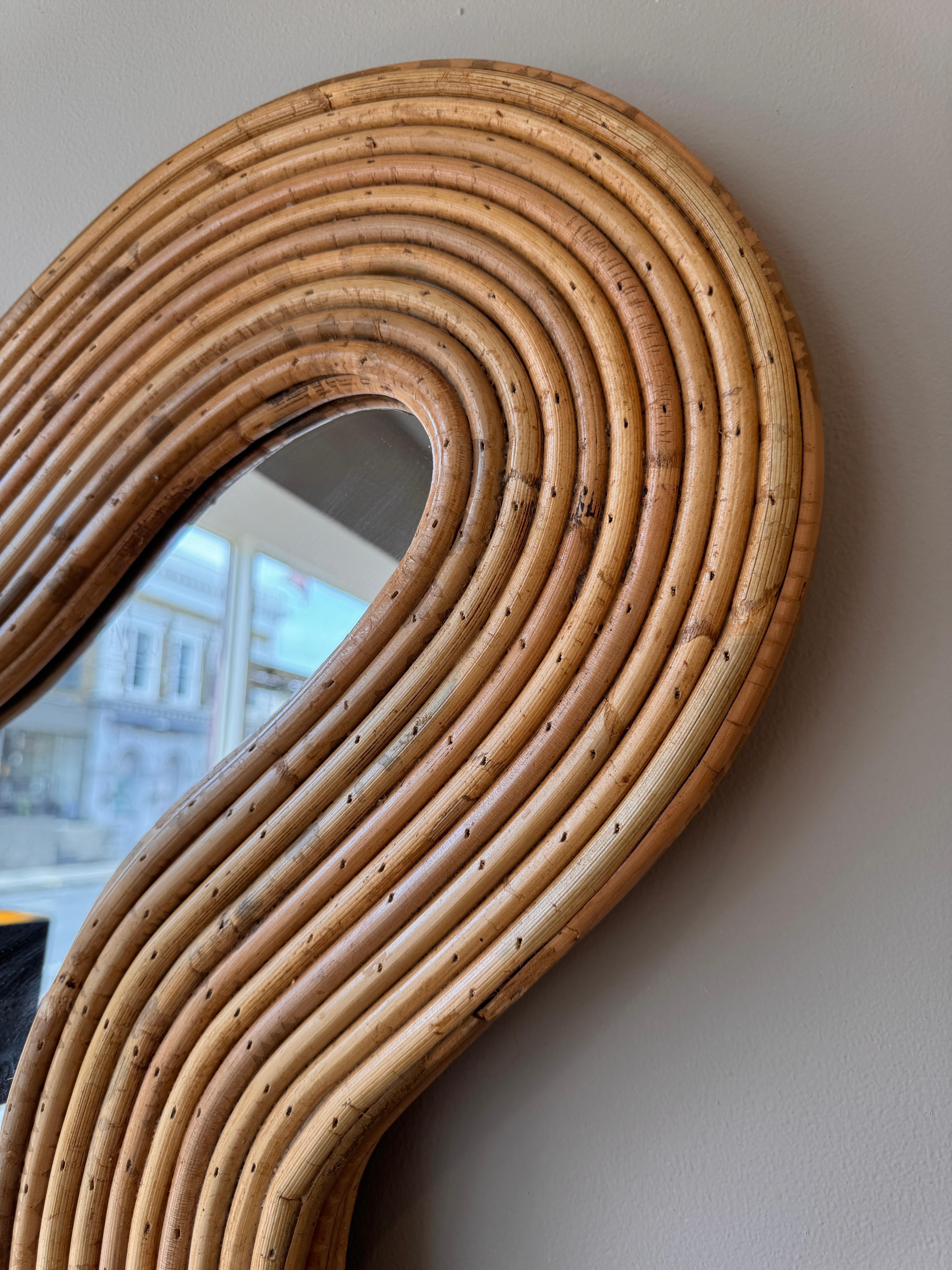 Hand made in Italy . A gorgeous large wavy bamboo wall mirror . C. Late 20th century 
Design attributed to Vivai Del Sud 