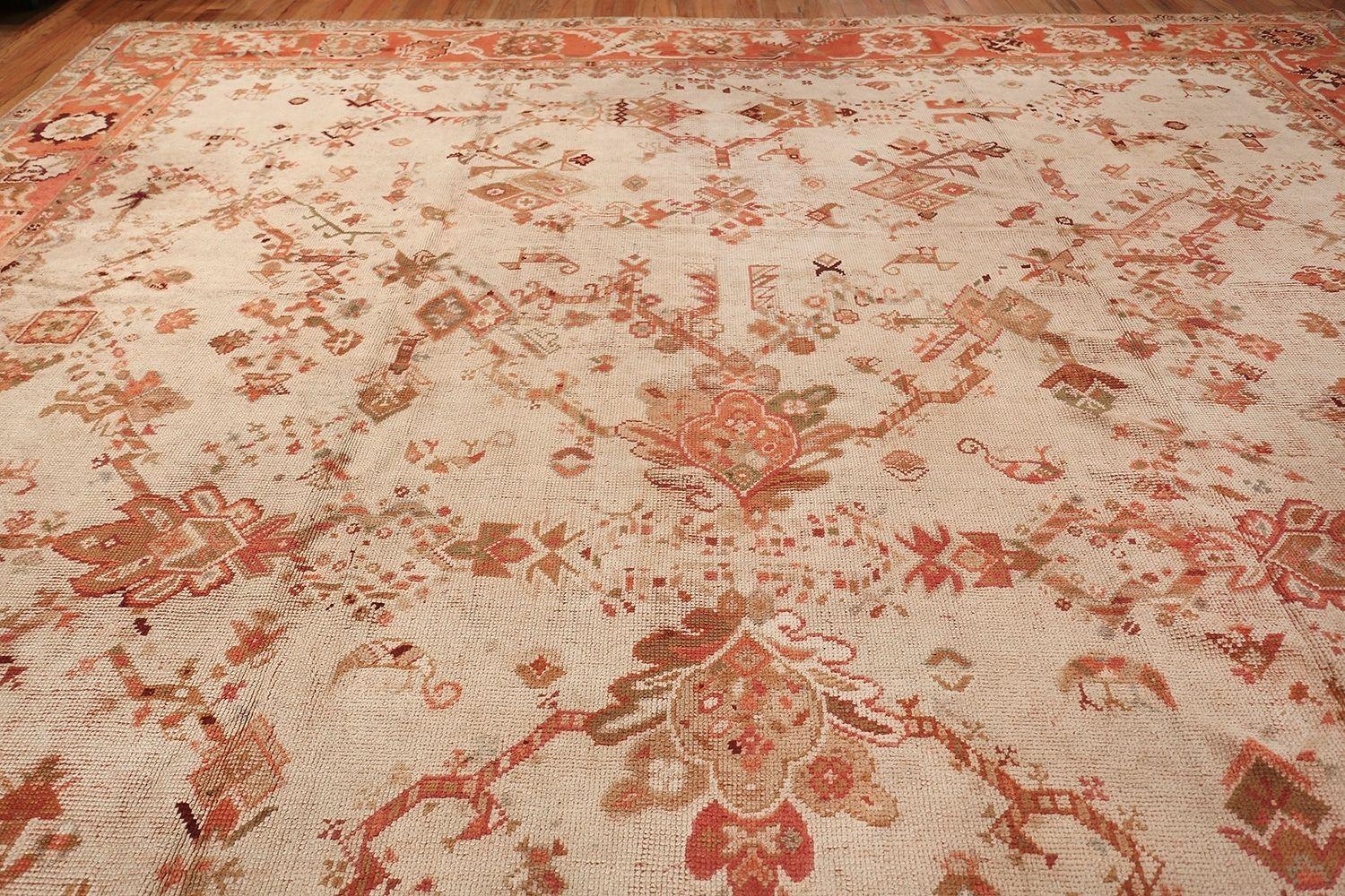Hand-Knotted Ivory Background Antique Irish Donegal Rug. 15 ft x 17 ft For Sale