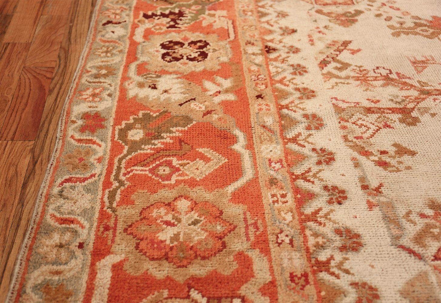 Wool Ivory Background Antique Irish Donegal Rug. 15 ft x 17 ft For Sale