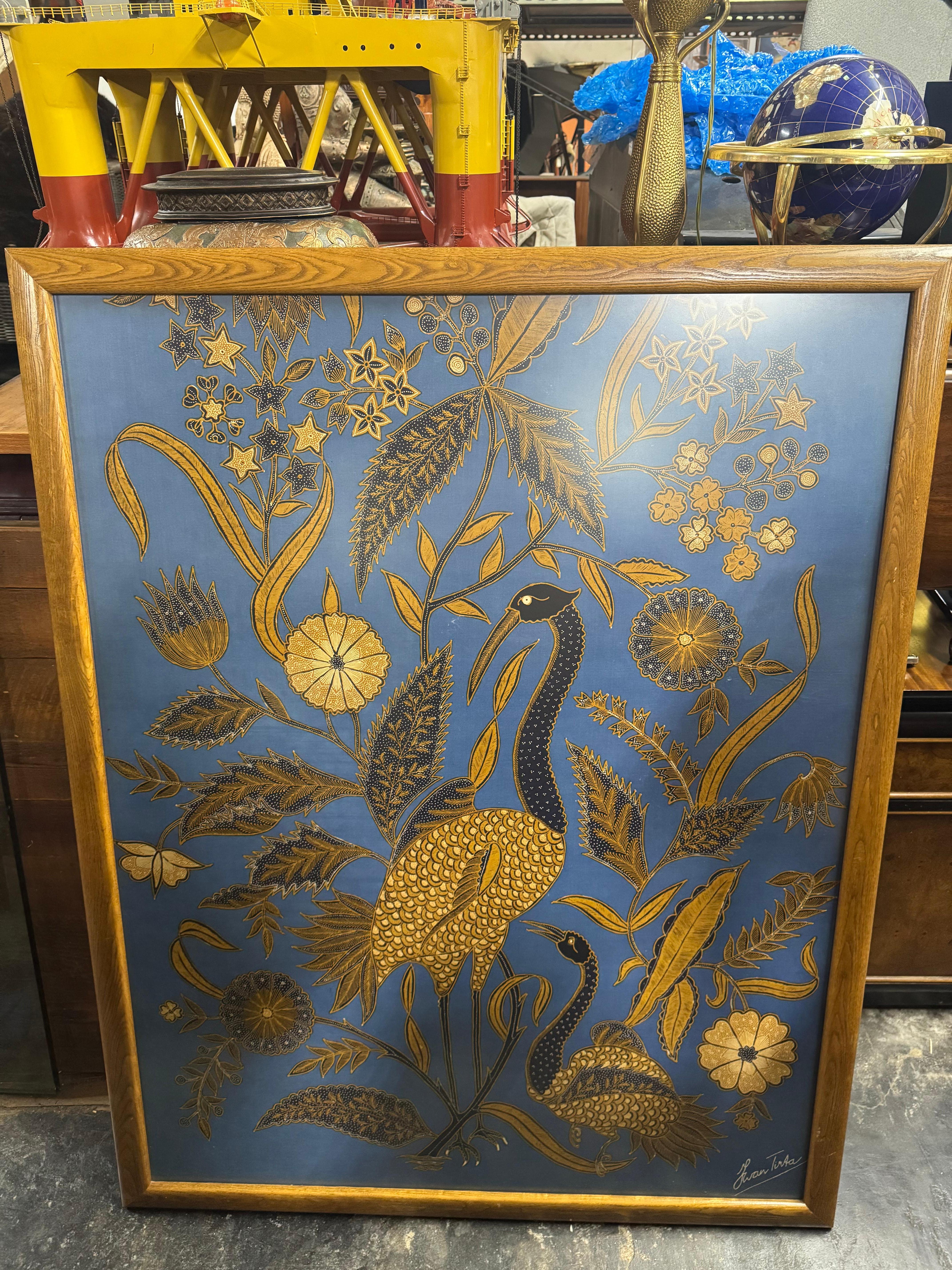 This is a framed artwork of famous batik fabric maker Iwan Tirta.
The frame size is 56
