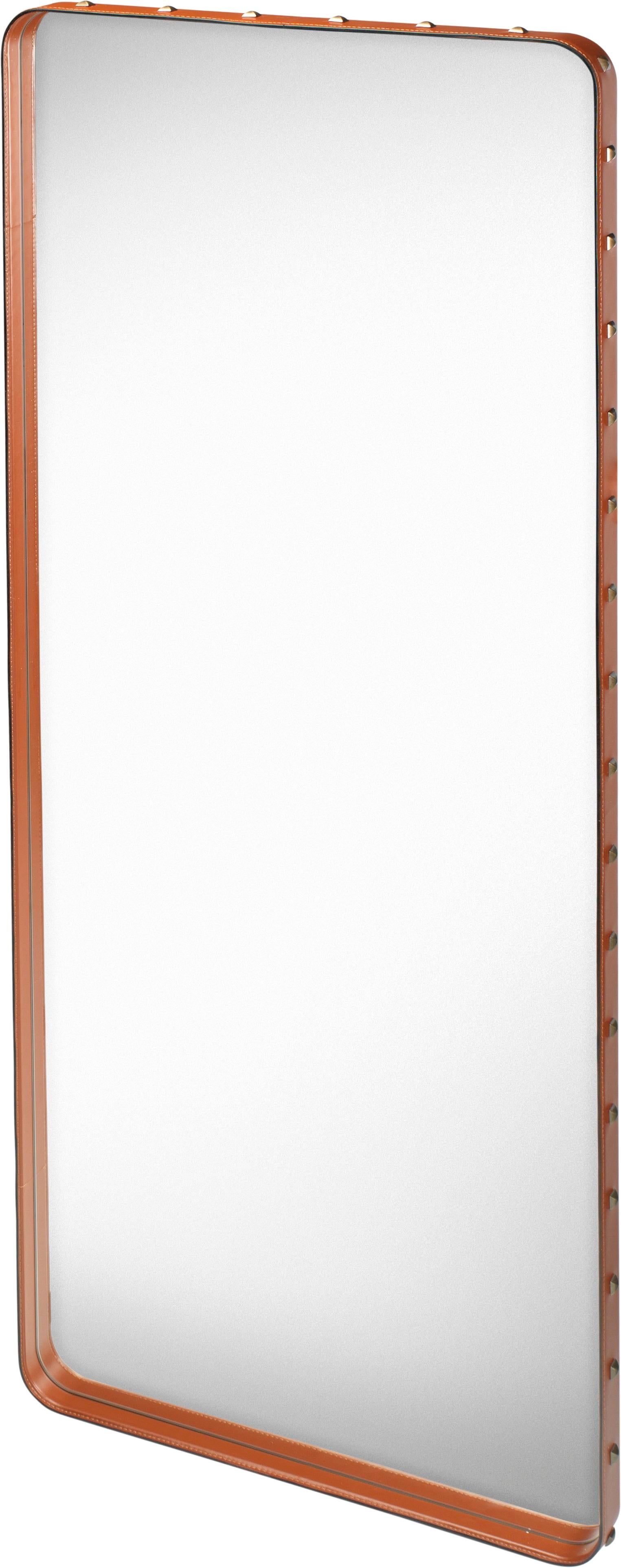 Large Jacques Adnet 'Rectangulaire' wall mirror in tan leather for GUBI. Originally designed by Jacques Adnet in the 1950s, this incredibly refined mirror is executed in high quality tan aniline leather and studded with burnished brass rivets on the