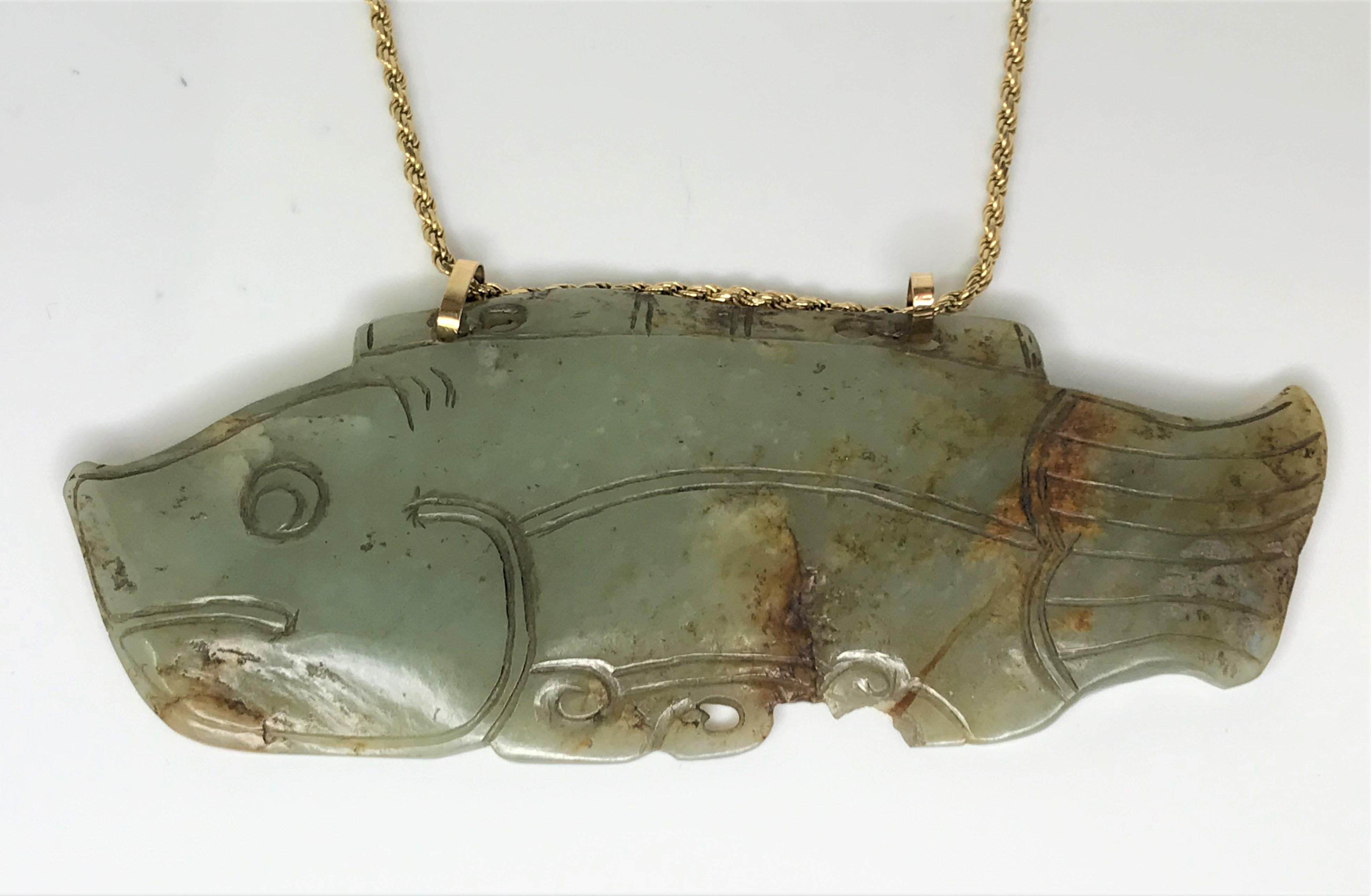 This one-of-a-kind pendant is sure to get attention.
Jade fish pendant - approximately 5.125 inches long x 2 inches high and 1/4 inch thick
A jade fish symbolizes wealth and abundance
Two gold bales at top of fish
14 karat yellow gold rope chain,