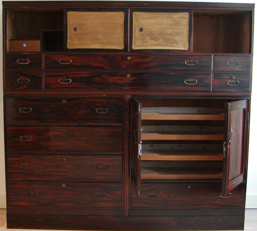 Large Japanese 3-section Clothing Chest, crafted of chestnut and cedar with the entire facade of a thick rosewood veneer. The storage composition has multiple drawers of varying sizes, hinged double door compartment with interior sliding kimono