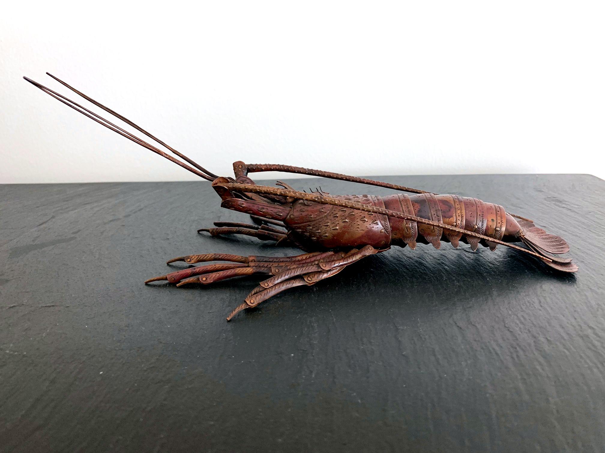 An articulate spiny lobster (Ise-Ebi) as an ornamental display item, known in Japanese as Jizai Okimono, was made by Myochin Hiroyoshi in the late Meiji Period. The lobster was meticulously constructed with copper or a copper alloy in a realistic