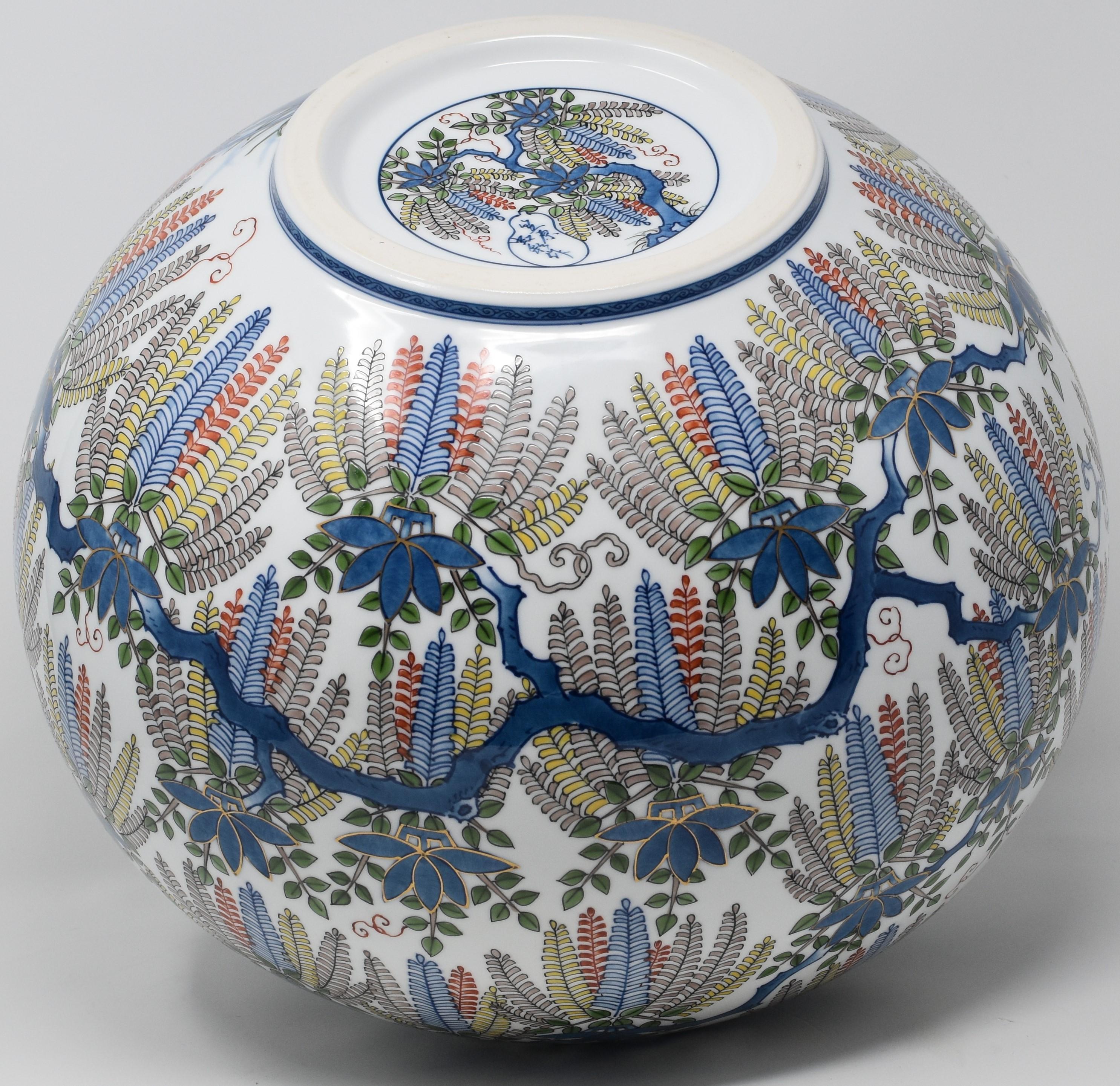 Extraordinary museum quality Japanese contemporary decorative porcelain vase, extremely intricately hand painted in blue, red and yellow on a stunningly shaped ovoid body, a signed masterpiece by widely respected award-winning master porcelain