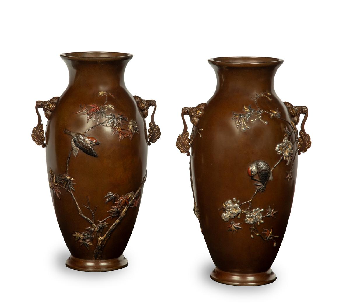 As part of our Japanese works of art collection we are delighted to offer this large scale pair of Meiji Period (1868-1912) bronze and mixed metal vases from the studios of the highly accomplished Imperial artist Suzuki Chokichi , his art name Kako.
