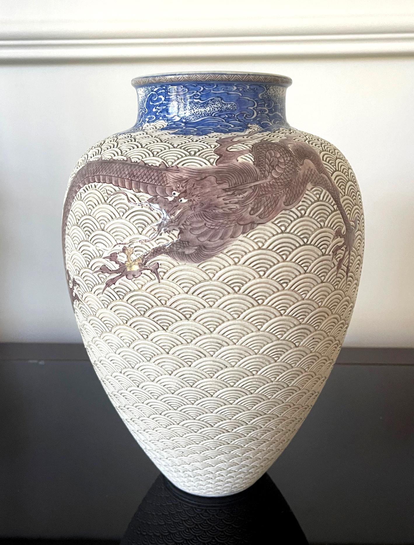 A large Japanese ceramic vase by the celebrated Meiji imperial potter Makuzu Kozan (1842-1916) circa 1880-1890s. Dated to his underglaze phase post 1887 after he successfully mastered the new colors available from the west and used them to the best