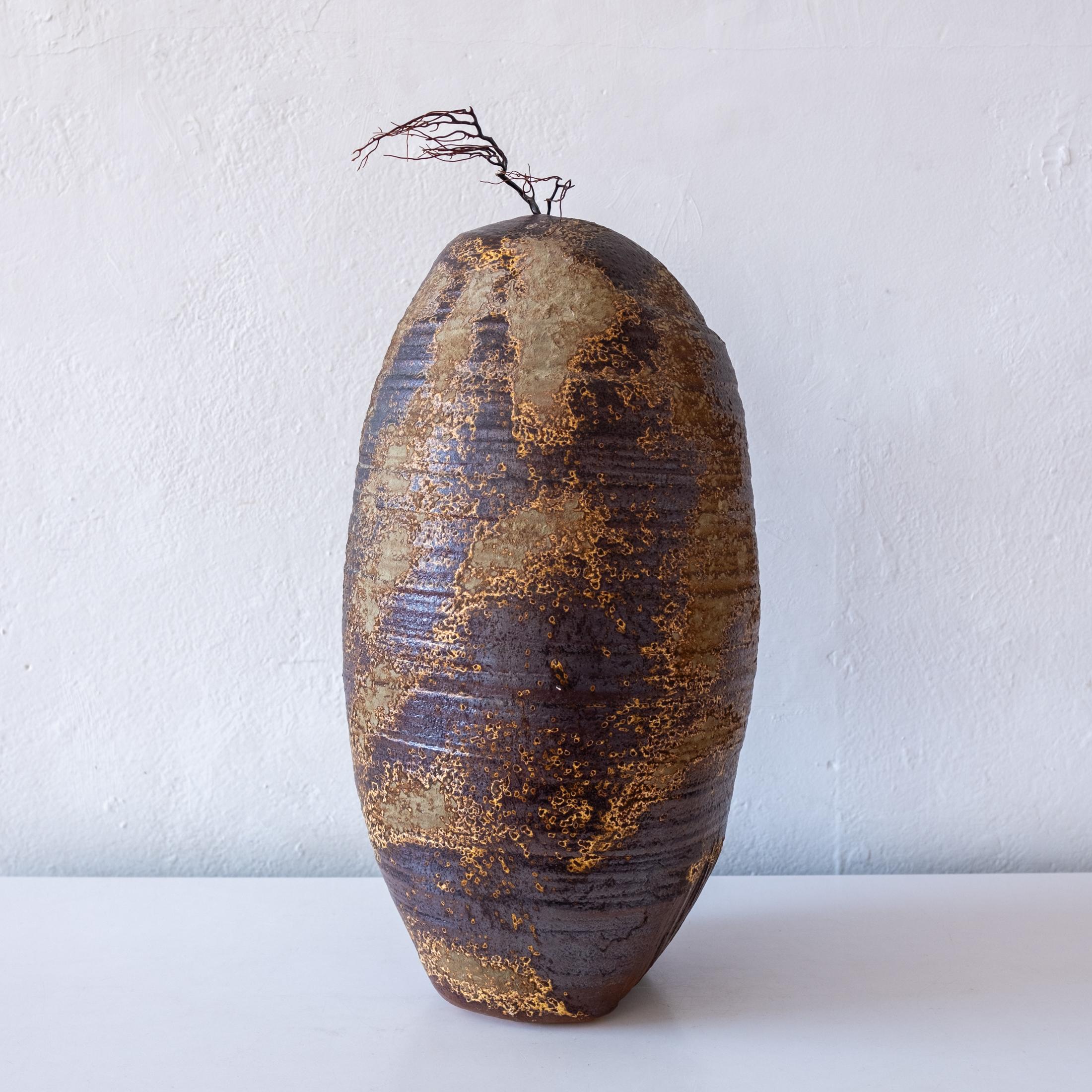 Large Japanese weed pot vase. An unusual and attractive modernist form. Expertly thrown and glazed. Beautiful coloring from the atmospheric wood firing. A very special piece. Signed on the bottom of the vessel with two cyphers. 