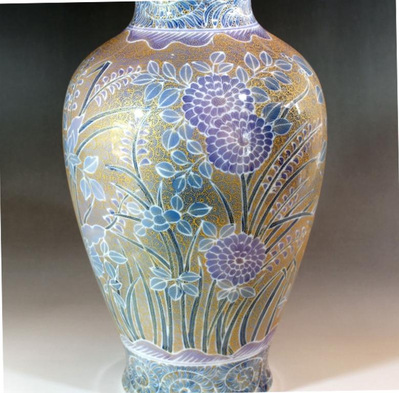 Exquisite large Japanese contemporary decorative porcelain vase, hand painted in extremely intricate patterns and extensive use of gold on vibrant blue on a beautifully shaped porcelain body. This is a signature masterpiece from an exclusive