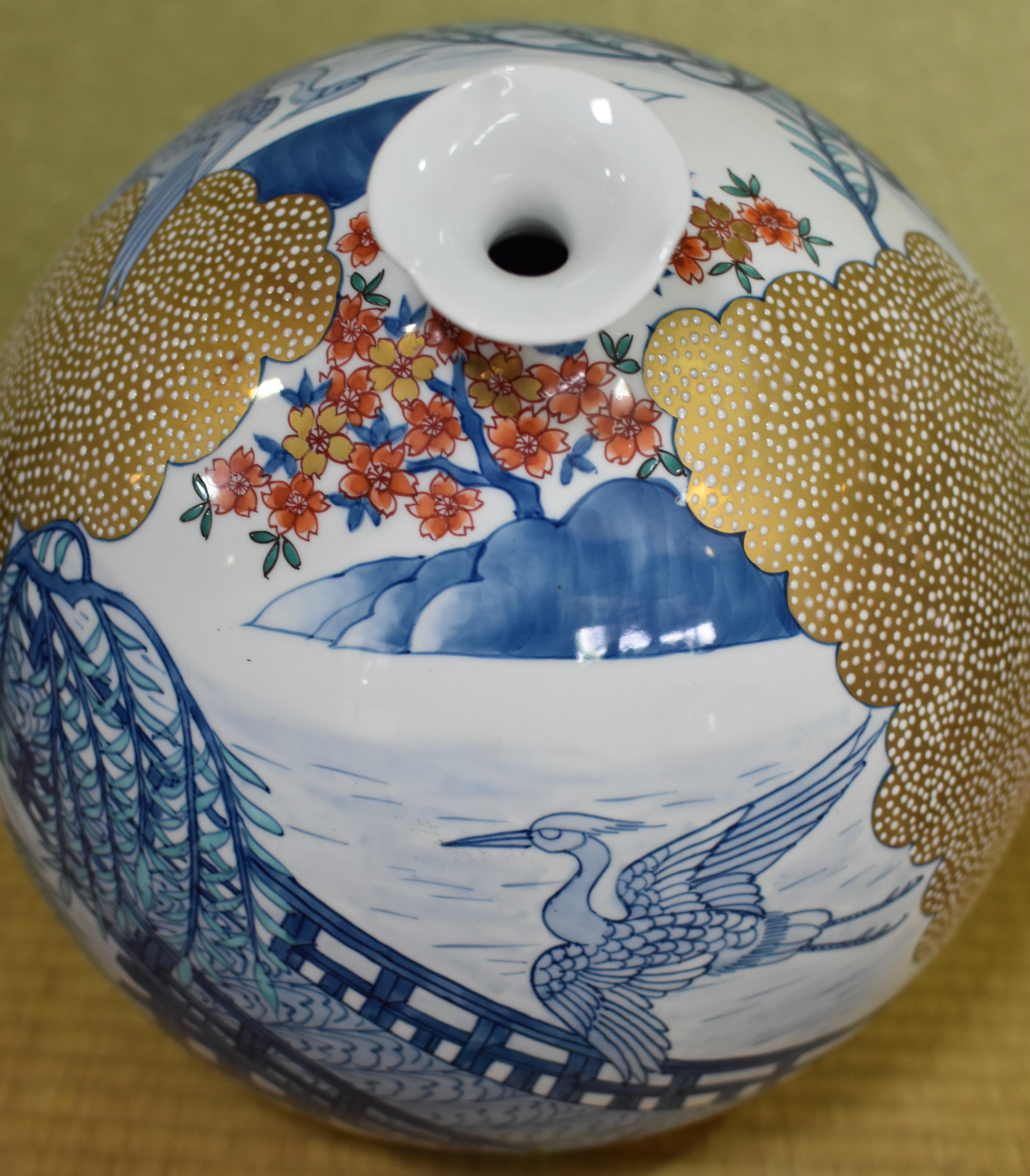 Exceptional Japanese contemporary large decorative porcelain vase, gilded and hand-painted in beautiful shades of blue on an attractive ovoid shape porcelain body, featuring a stunning combination of blue underglaze, polychrome overglaze and