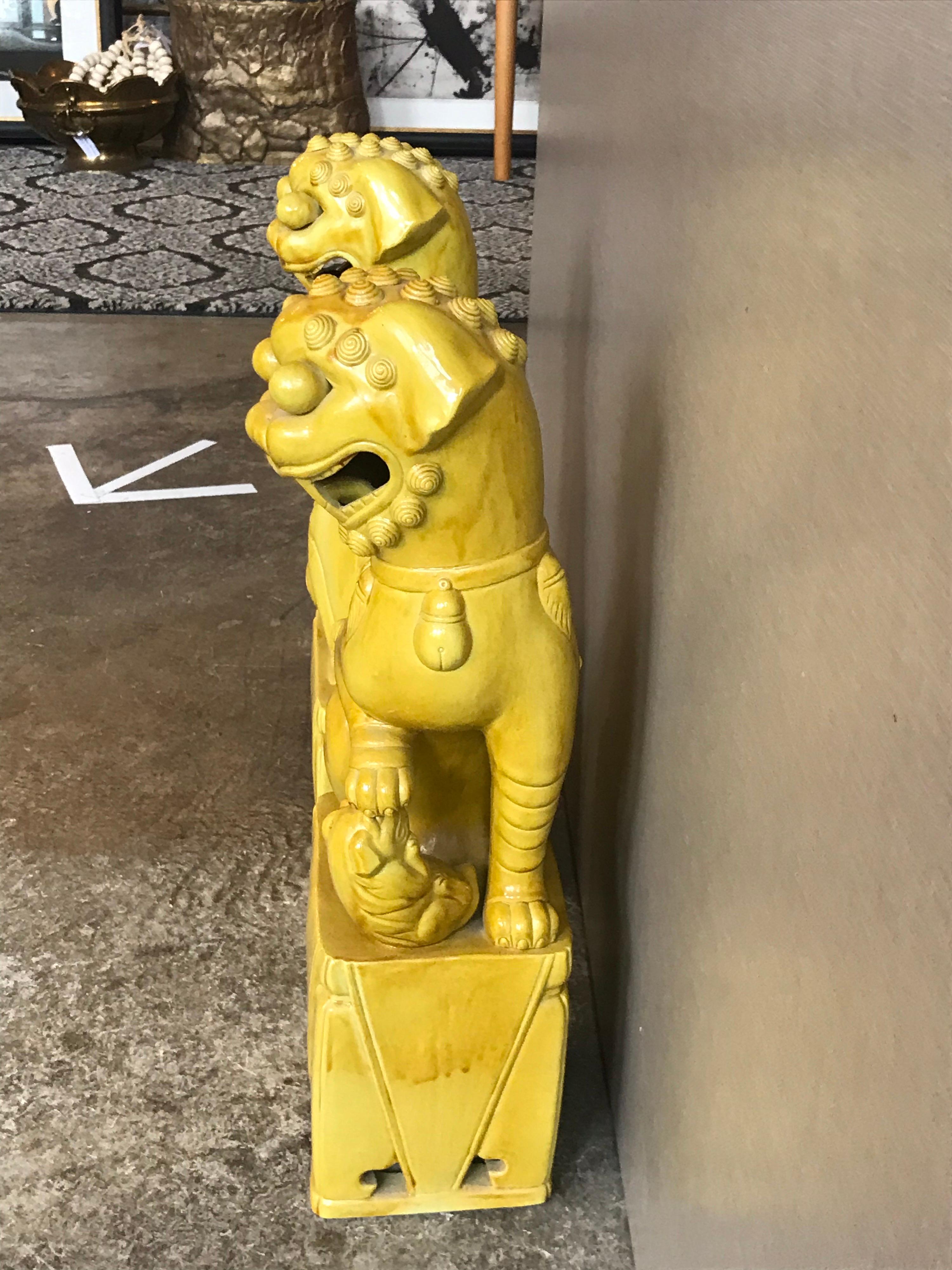 This is a pair of yellow glazed vintage Japanese Foo dogs from the 1970s-1980s.