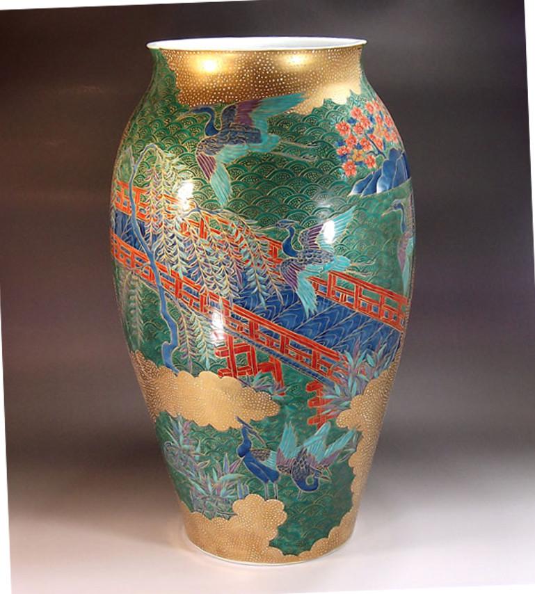 Extraordinary large contemporary Japanese decorative porcelain vase, gilded and intricately hand-painted in blue, green and red on a beautifully shaped body, featuring a stunning combination of polychrome overglaze and extensive gilding. It is a