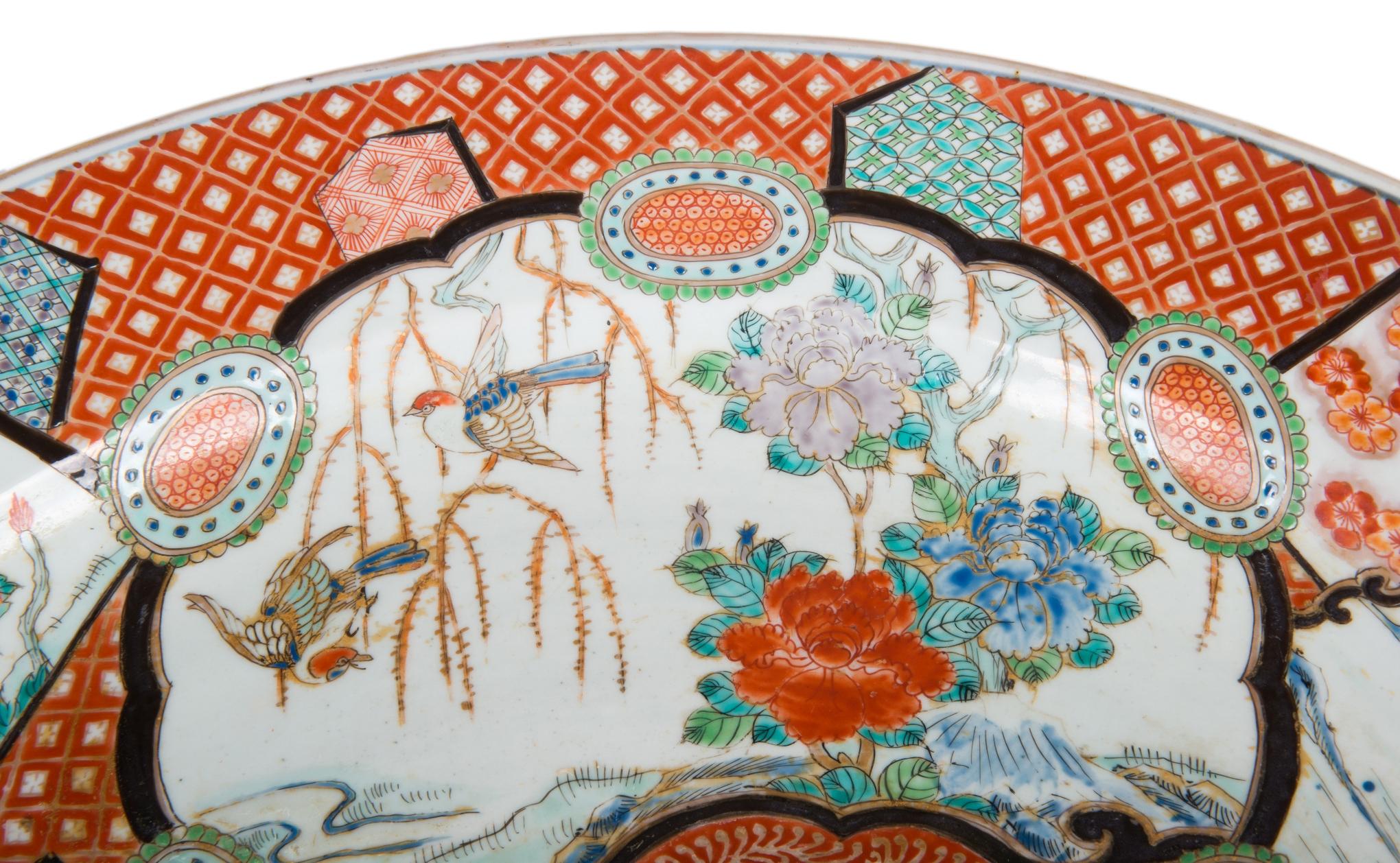 A very good quality 19th century Japanese Imari charger, having classical motif decoration to the ground, panels with exotic birds, mountainous scenes and flowers.