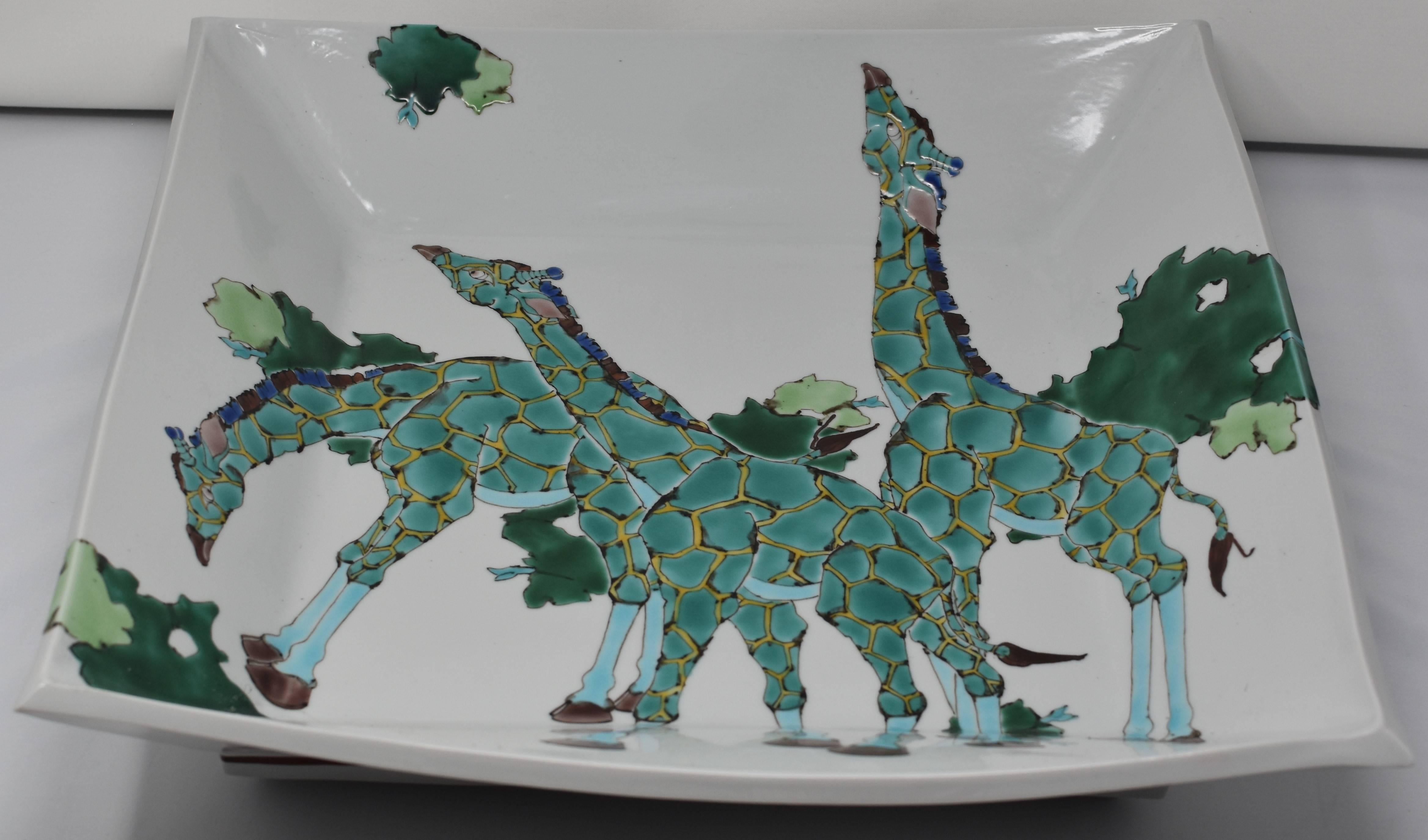 Unique contemporary large Japanese Kutani hand-painted porcelain square-shaped deep charger with a unique interpretation of giraffes in green. This is part of a series of pieces featuring the animals of the African savannah. Depicted here are