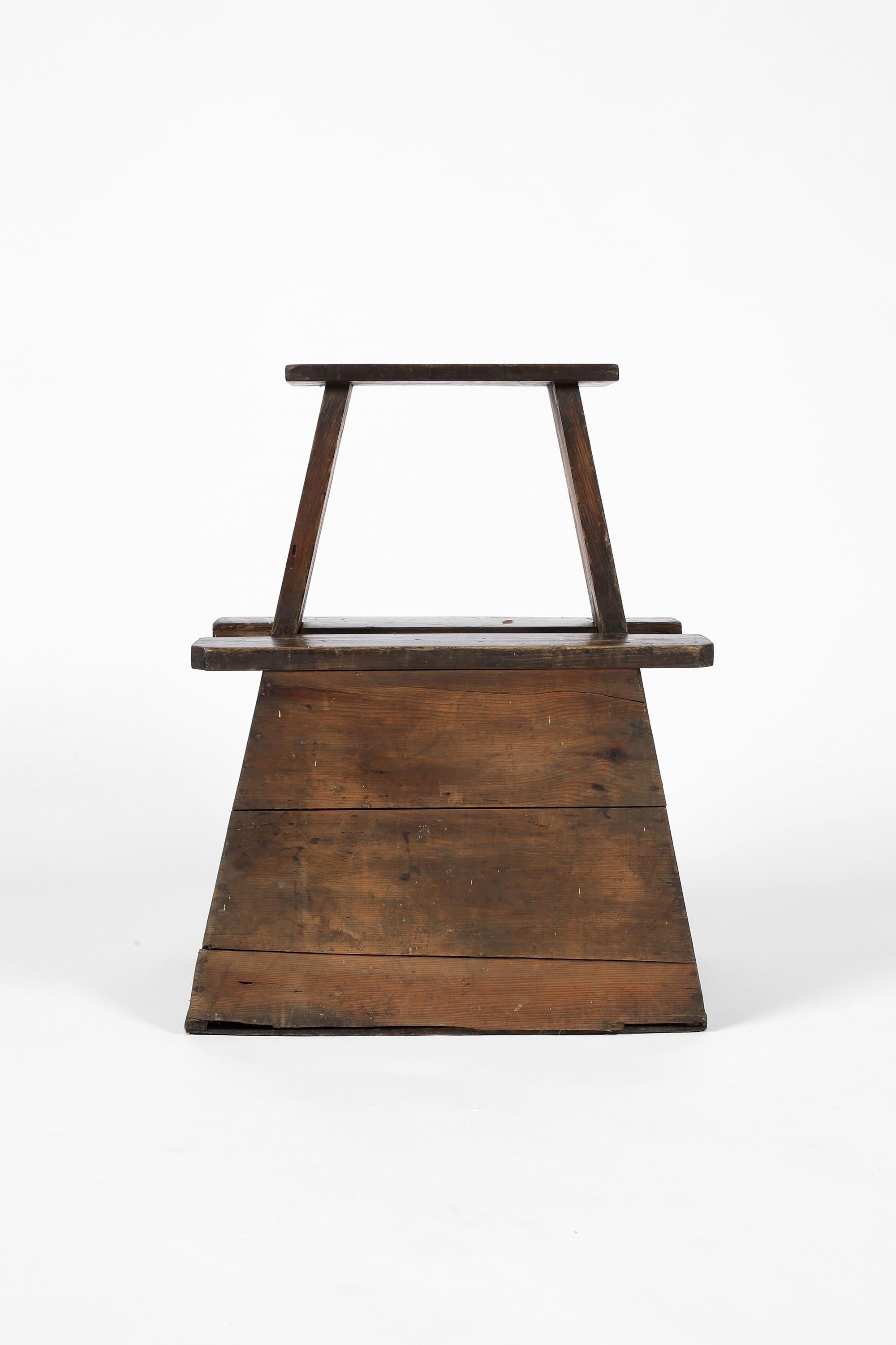 A large and atypical Meiji era street vendor stool/step constructed from heavily patinated cedar timber. 
