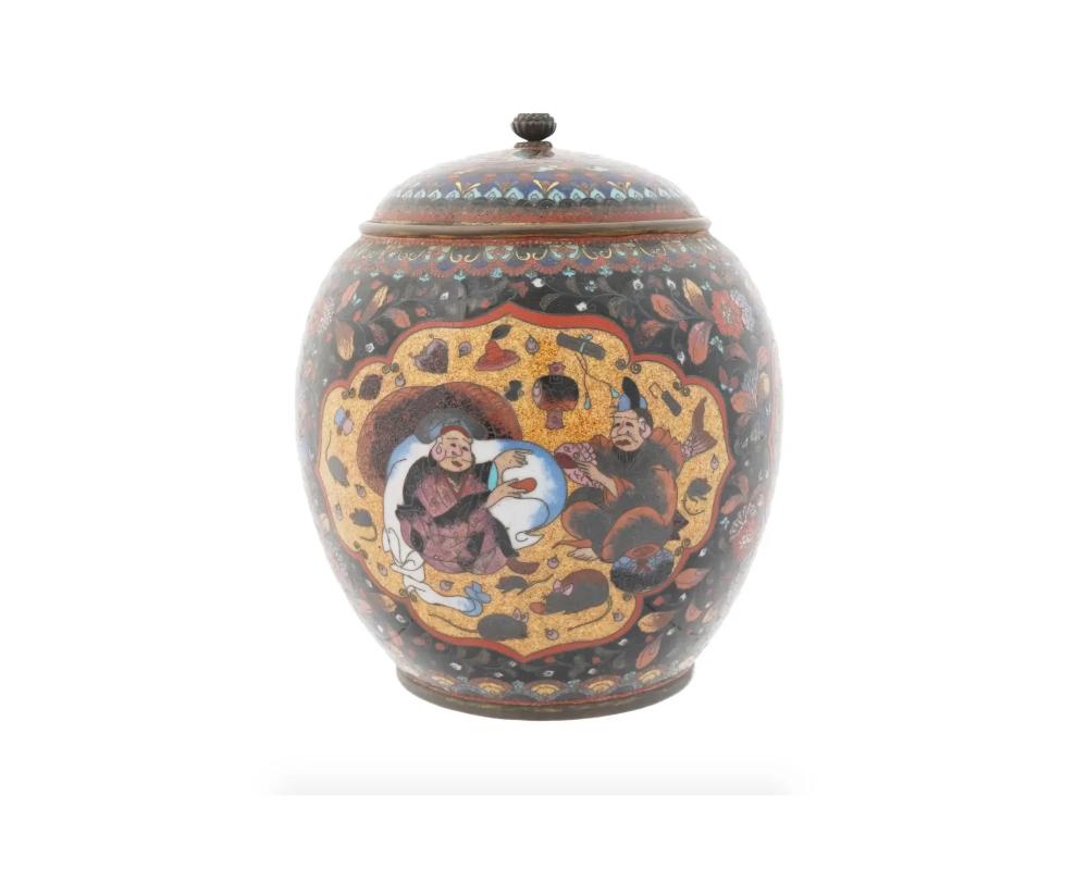 A large antique Japanese Meiji Era lidded brass and enamel jar. Circa: late 19th century to early 20th century. The sphere form jar is enameled with a polychrome medallion scene with two male figures and a medallion with an image of a dragon