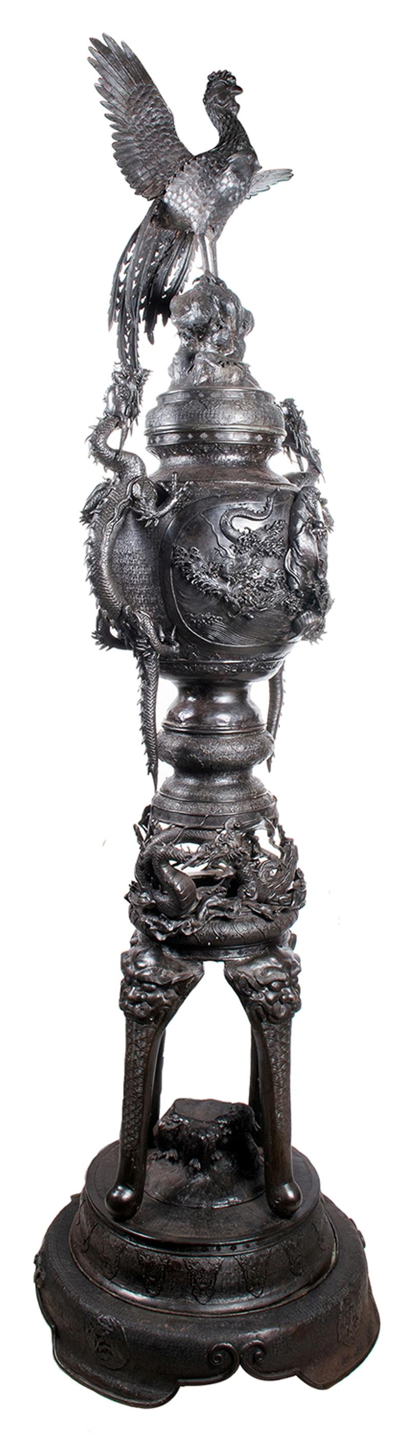 A very large and impressive good quality Japanese Meiji period (1868-1912) patinated bronze Koro. Having wonderful mythical dragon handles, a Peacock finial, an Eagle in a tree top and a Sea God under the waves. Above entwined dragons and four