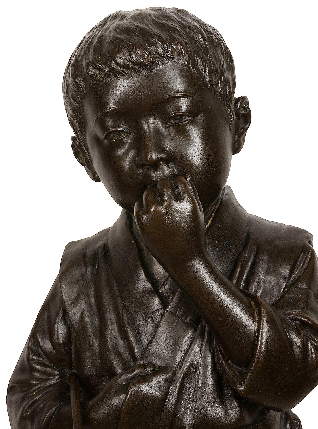 A large very good quality late 19th century (Meiji period 1868-1912) Japanese patinated bronze statue of a young child in traditional dress holding a play hoop. Measures: 60cm (24