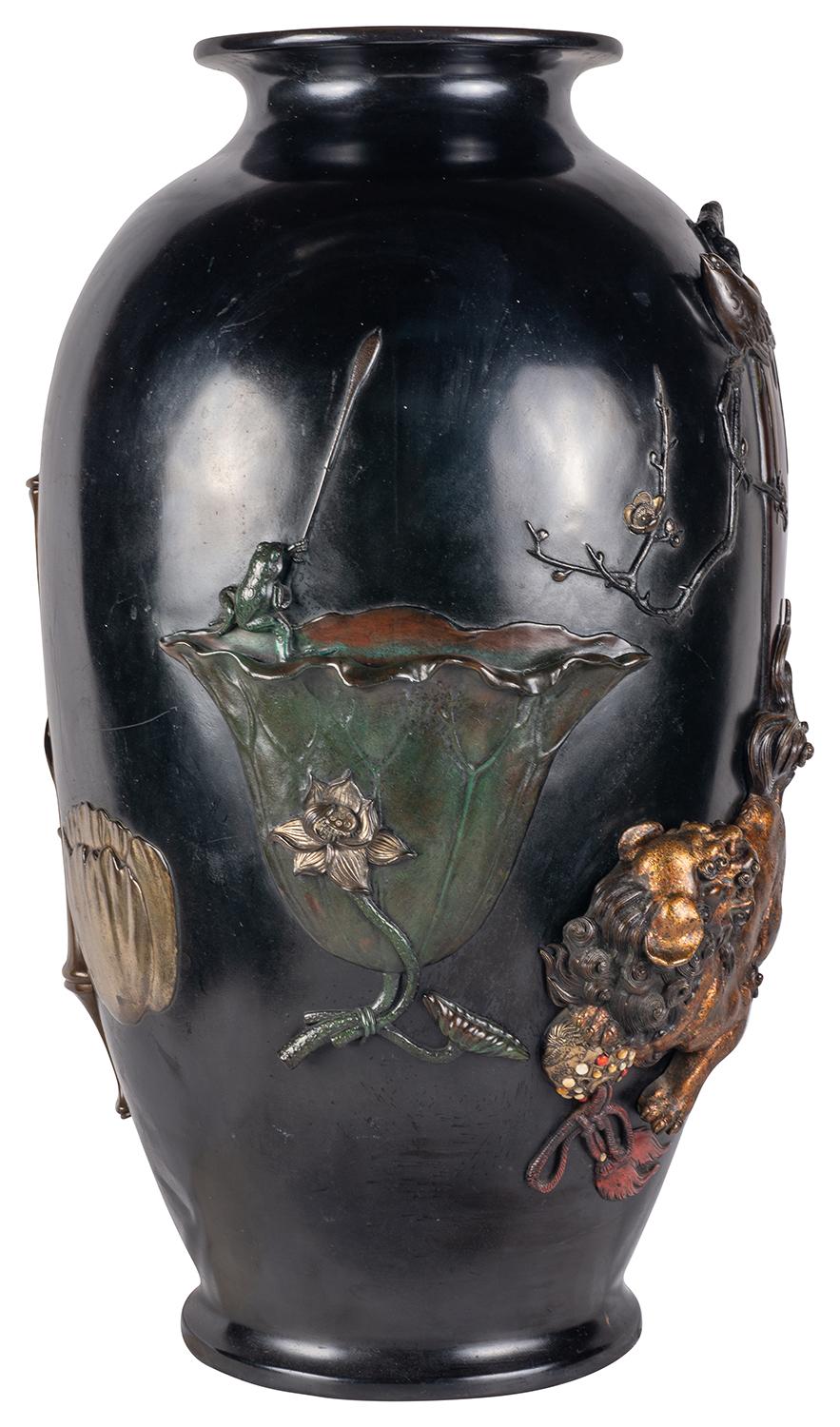A wonderful Japanese Meiji period (1868-1912) Bronze overlay vase. Having exquisite and amusing scenes in relief, patinated and overlay of a Dog of Foo, a Frog fishing in a Lotus leaf cup, a Bamboo and bronze vase and jardiniere. a larger bronze