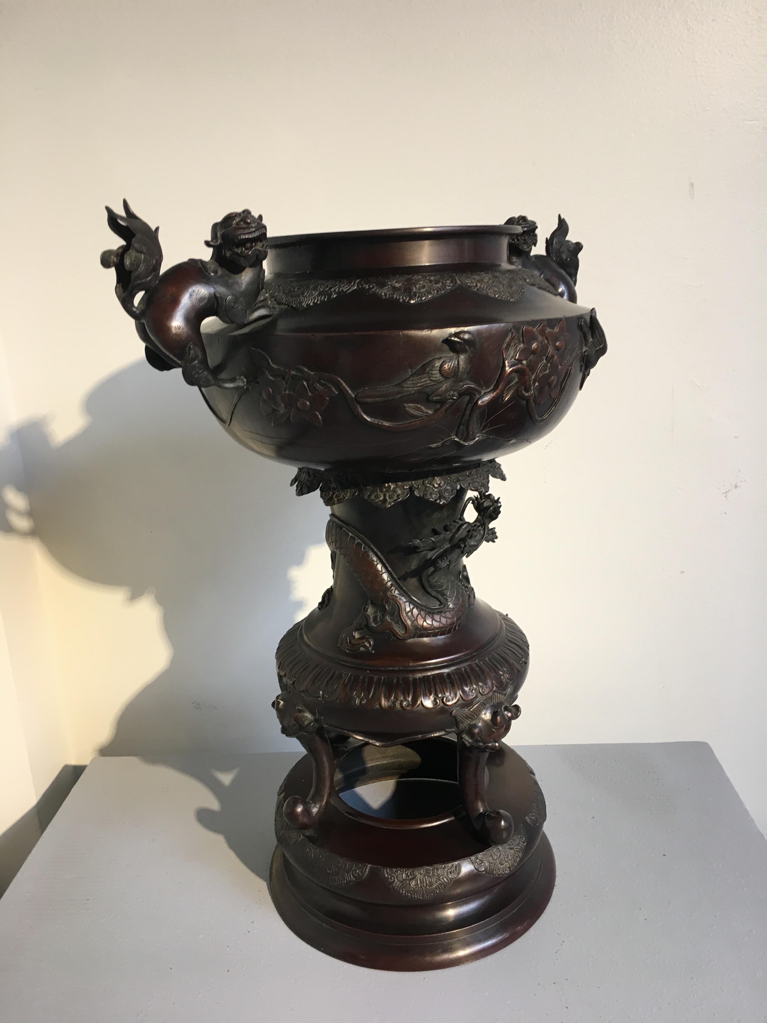 A large and attractive Japanese bronze incense burner, Meiji period, late 19th or early 20th century.
The bulbous body of the censer supported by a large pedestal foot and set upon an integral stand.
The bowl of the censer is decorated with a