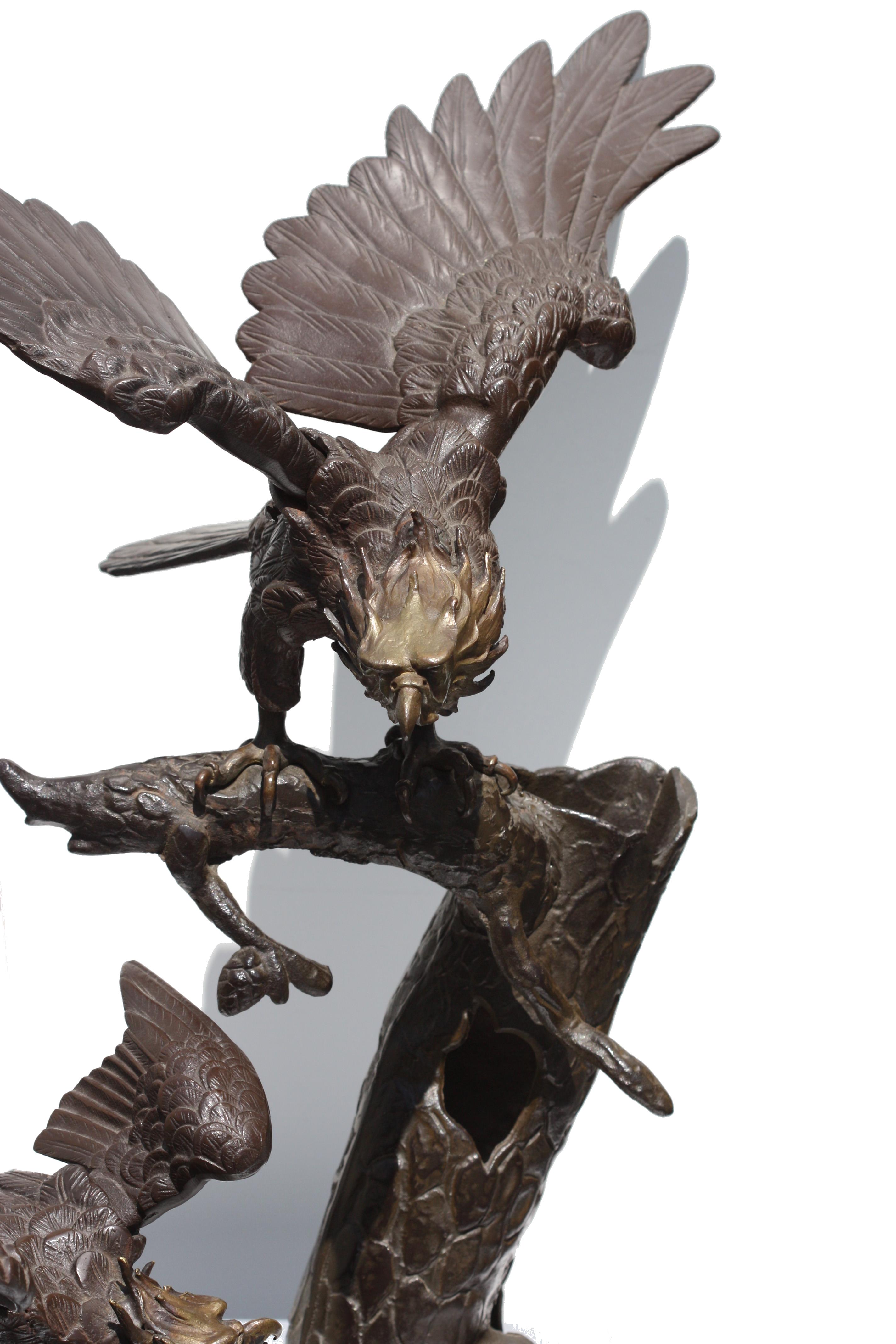 
Large Japanese Patinated Bronze and Iron Eagle Sculpture Group
Meiji Period. Representing two eagles on a tree stump, with gilt highlights.
Height is 26 in. Width 34 in.