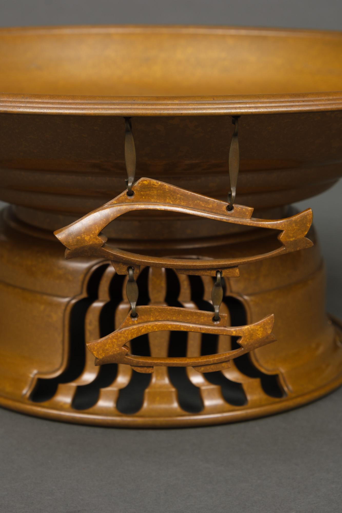 Large and heavy Japanese light brown patinated bronze footed water basin (suiban) with a mottled golden motif. The bowl with stepped concave rings and a nice thin double ribbed rim. From the side down hang three two-tiered open work pendants in the
