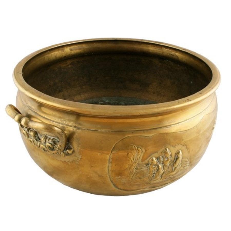 A large late 19th to early 20th century Meiji period (1864-1911) Japanese polished bronze planter.

The planter has two Japanese landscape scenes cast in the sides and stands on three integral shaped feet.

The planter has two cast handles in