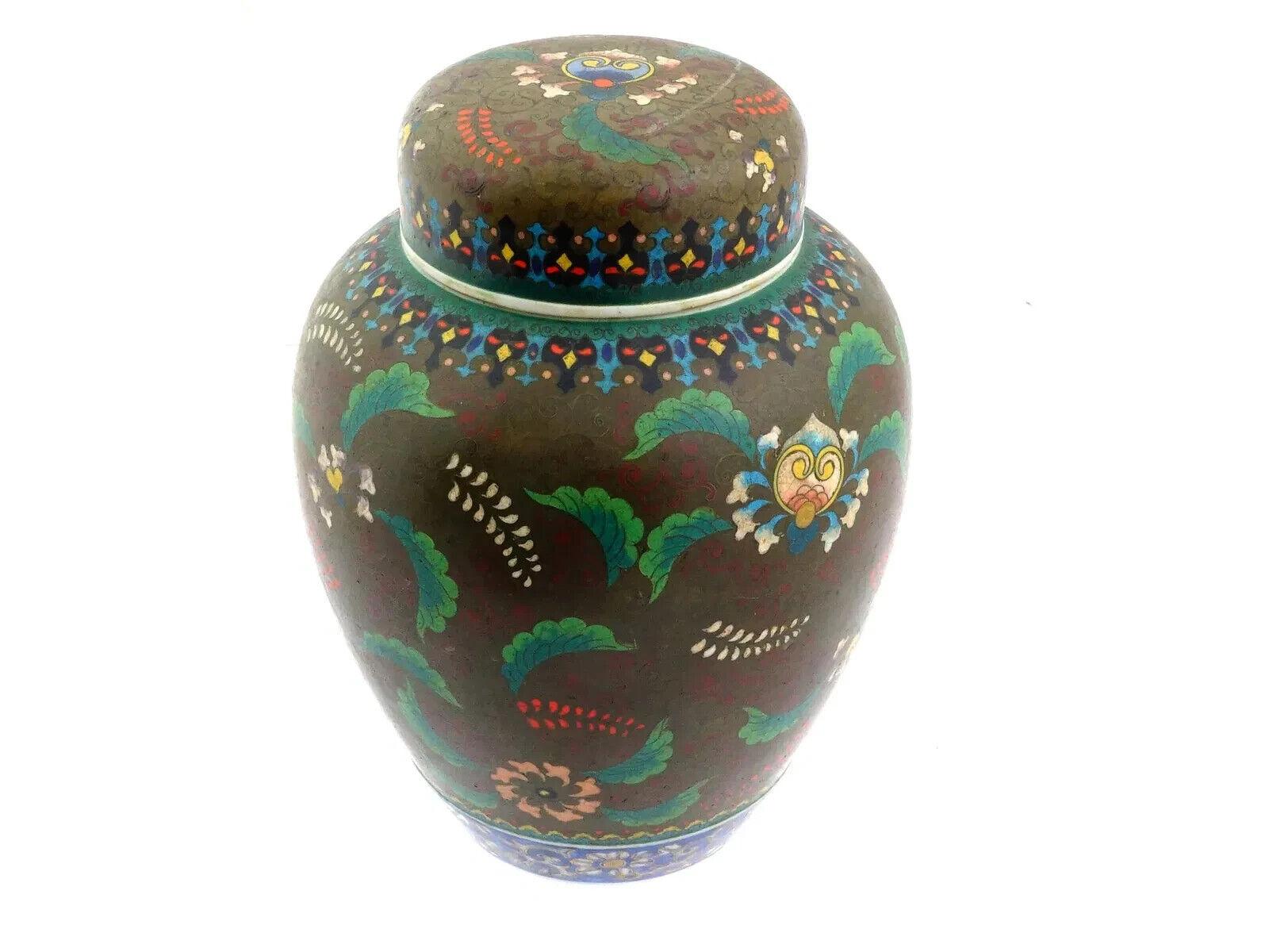 A large Japanese covered Totai enamel on porcelain ginger jar. The ware is enamelled with polychrome floral and foliage ornaments made in the Cloisonne technique. The cover of the ware is adorned with floral, foliage and geometrical ornaments made