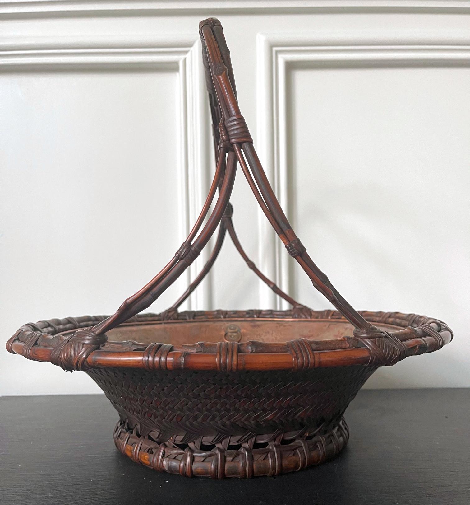 A large and impressive Japanese basket in the form of a morikago by Maeda Chikubosai I (1872-1950) circa first half of the 20th century. Chikubosai I was from the Kansai Region and active in Sakai, Osaka prefecture. He was instructed by Wada