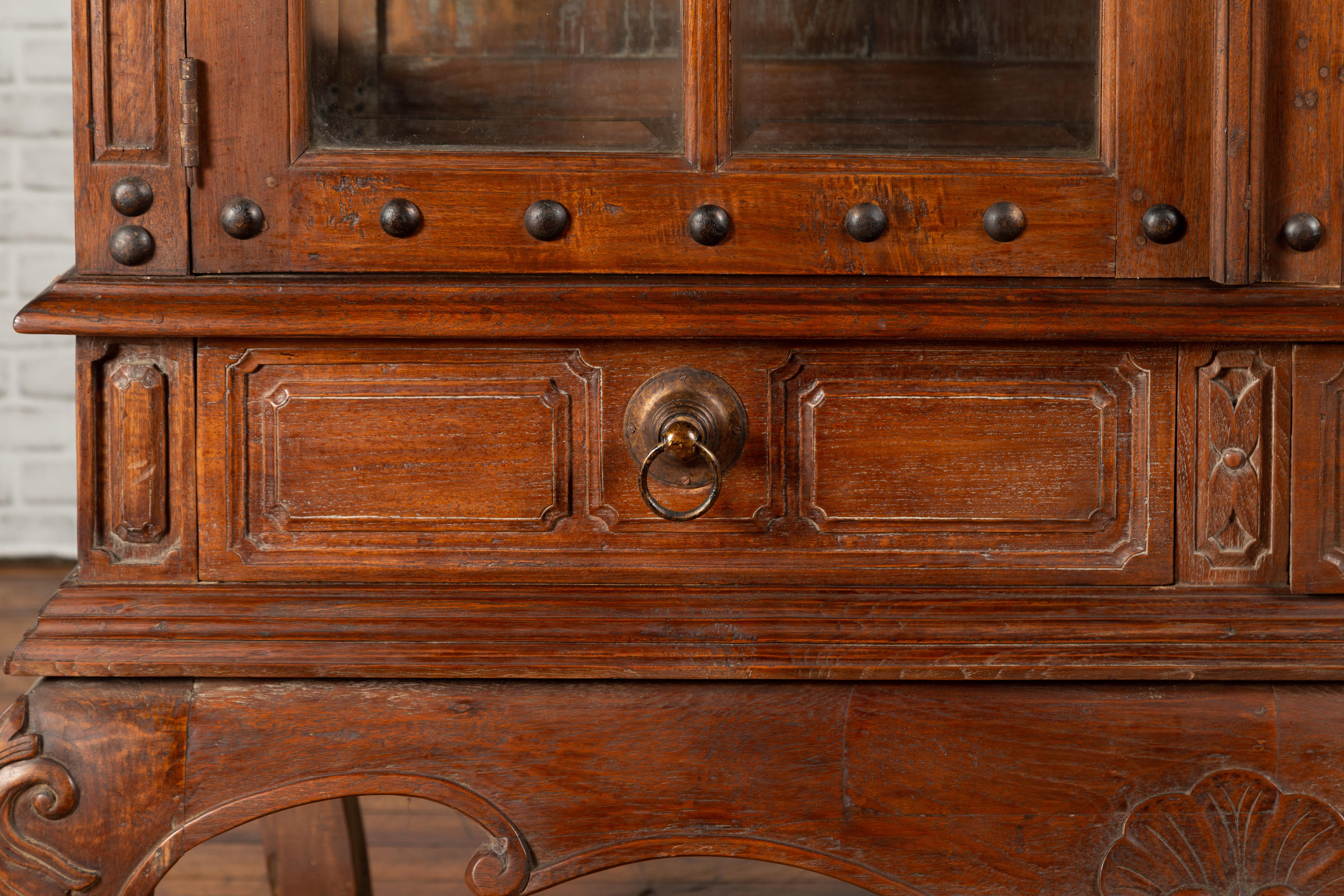 Large Javanese Cabinet with Paneled Glass Doors, Bonnet Top and Cabriole Legs In Good Condition For Sale In Yonkers, NY