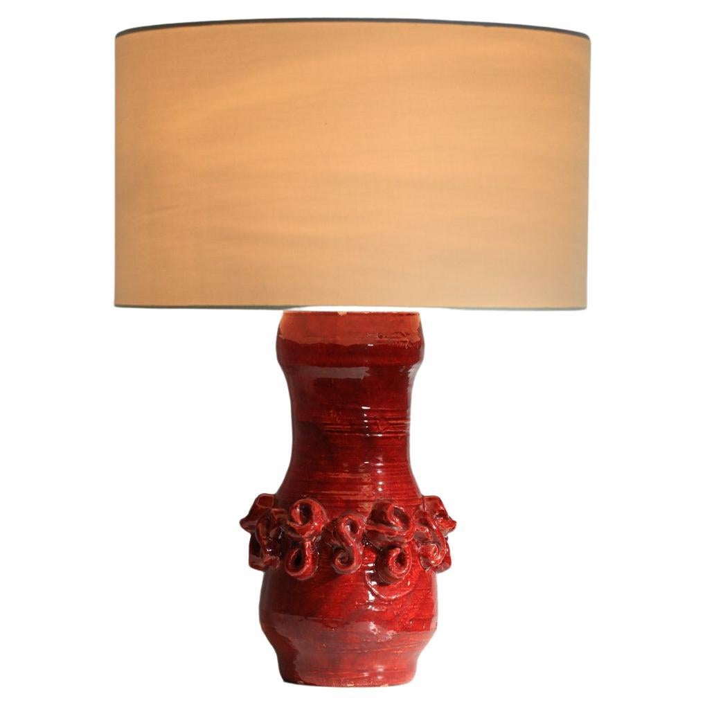 large Jean Austruy 50's red enamelled ceramic table lamp