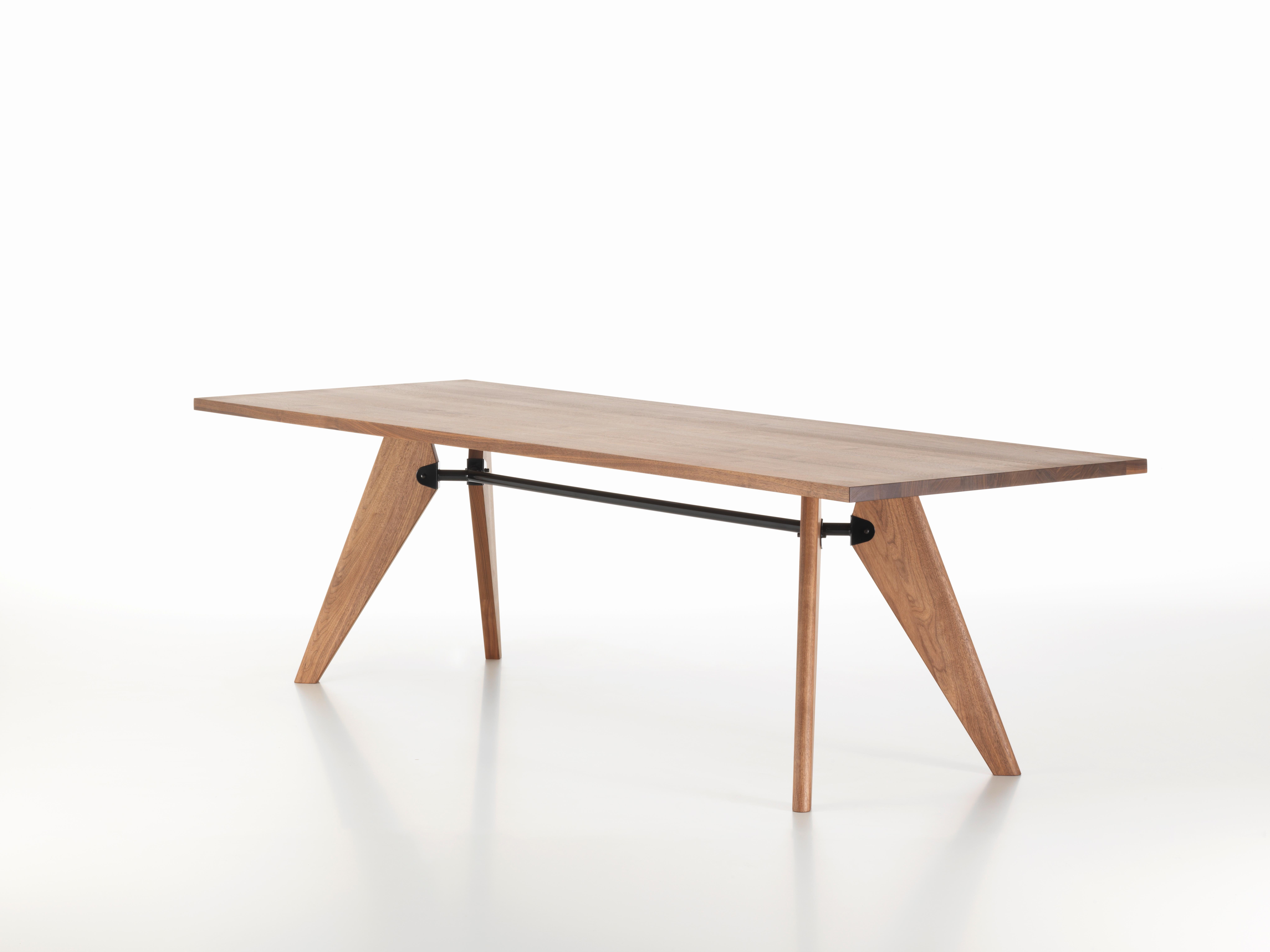 Large Jean Prouvé table Solvay in American walnut for Vitra. The Table Solvay is an early masterpiece by the French designer and engineer Jean Prouvé. During the Second World War, the Ateliers Jean Prouvé were commissioned for a number of interior