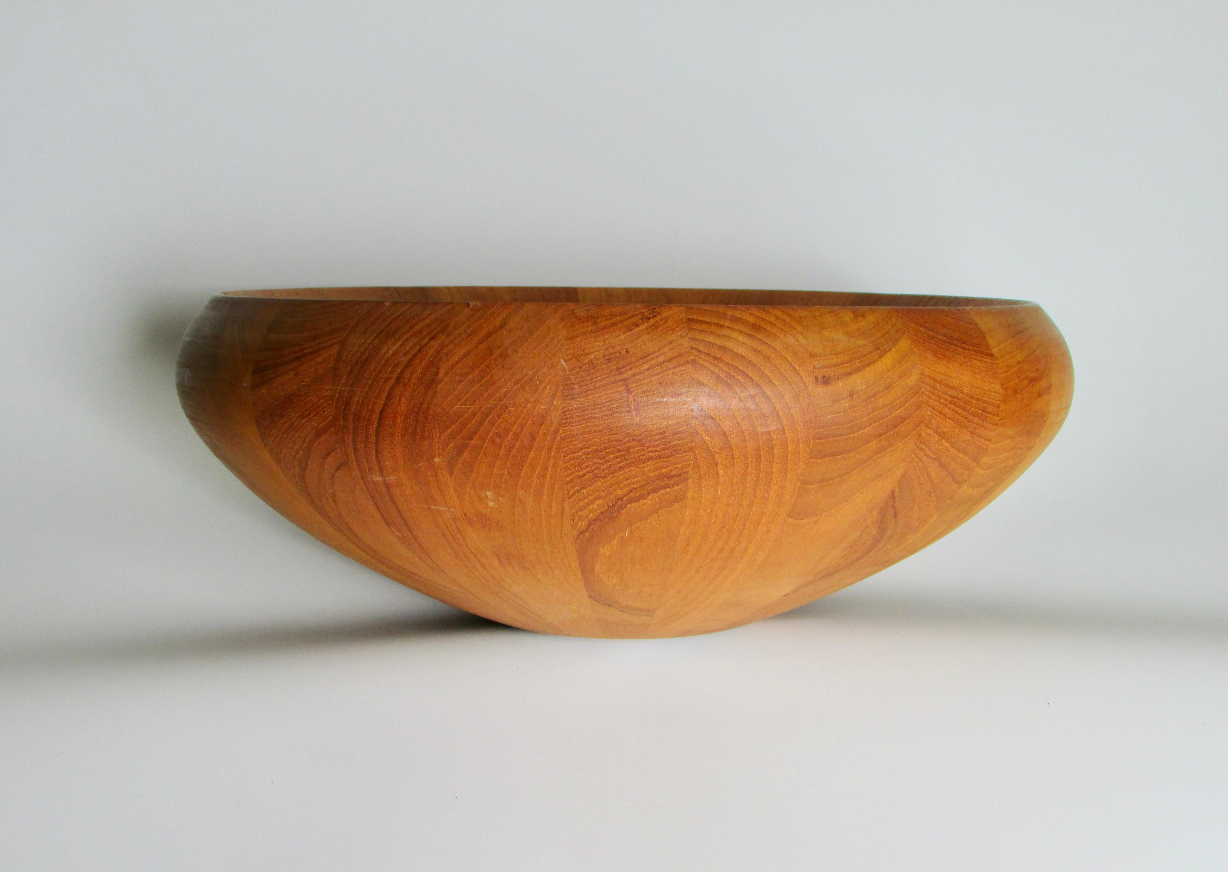 One of the many bowls designed by Jens H. Quistgaard for Dansk Denmark . Beautifully proportioned Staved Teak sculptural and utilitarian . Fine condition . Very minor evidence of any use . 
