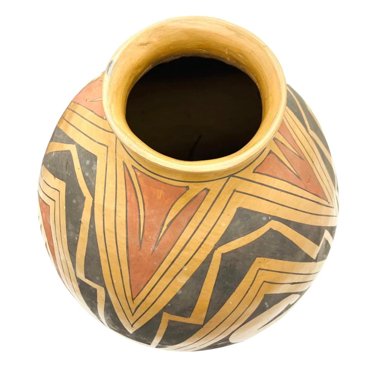 Large Jerónimo Villalpando Acoma Pottery Vase. Colors are red and black on a tan background. Signed on bottom.