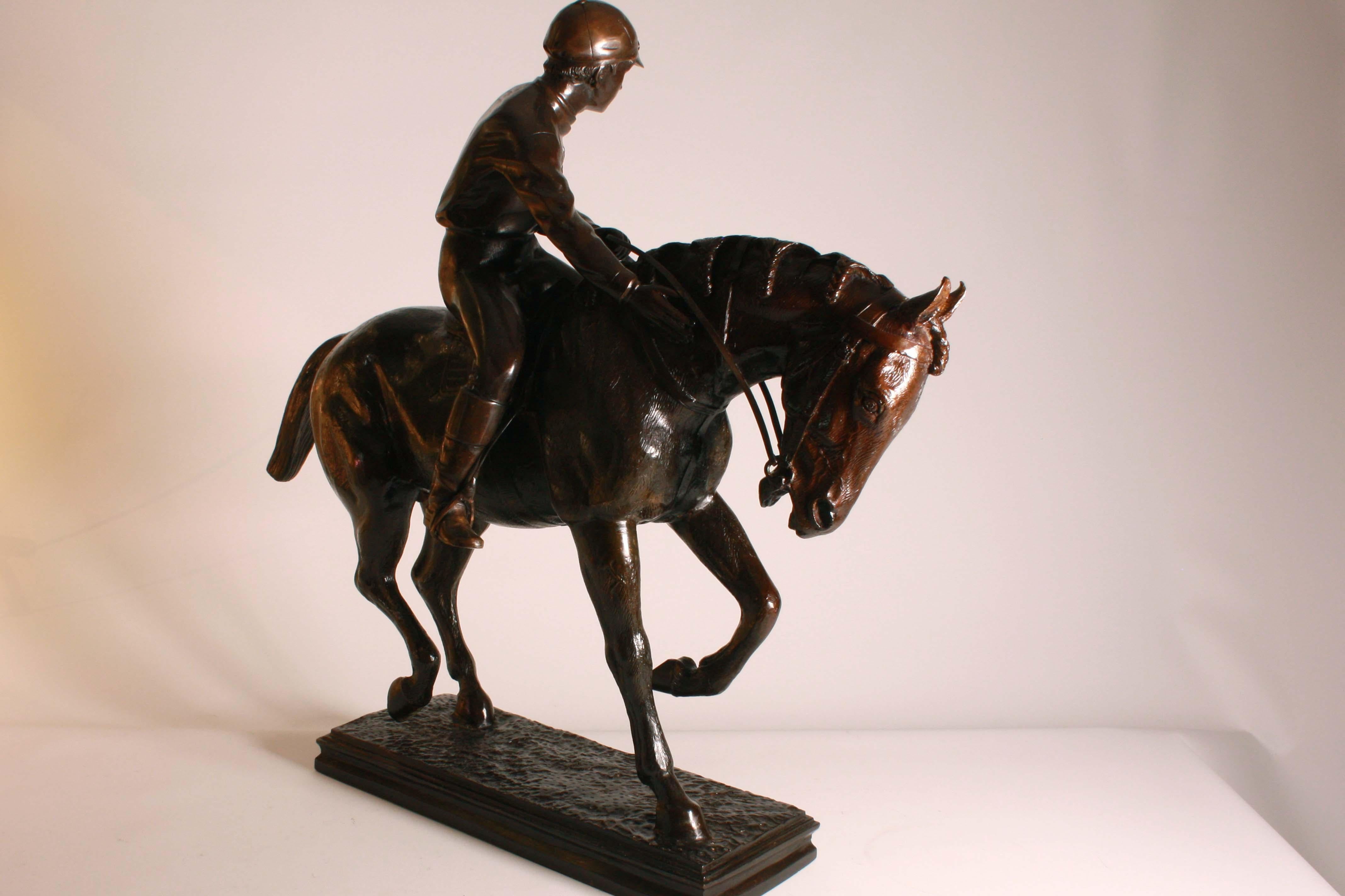 French Victorian (19th century) large bronze figure of a jockey astride a galloping racehorse.

The bronze measures 24