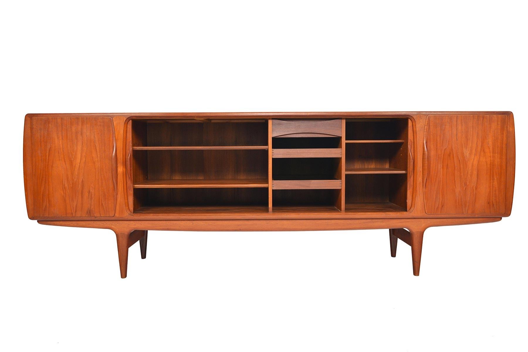 The genius is in the details with this magnificent Danish modern tambour door credenza. Designed by Johannes Andersen for Uldum Møbelfabrik in the 1960s, this rare credenza is unlike any other. The center offers tambour doors so delicately crafted