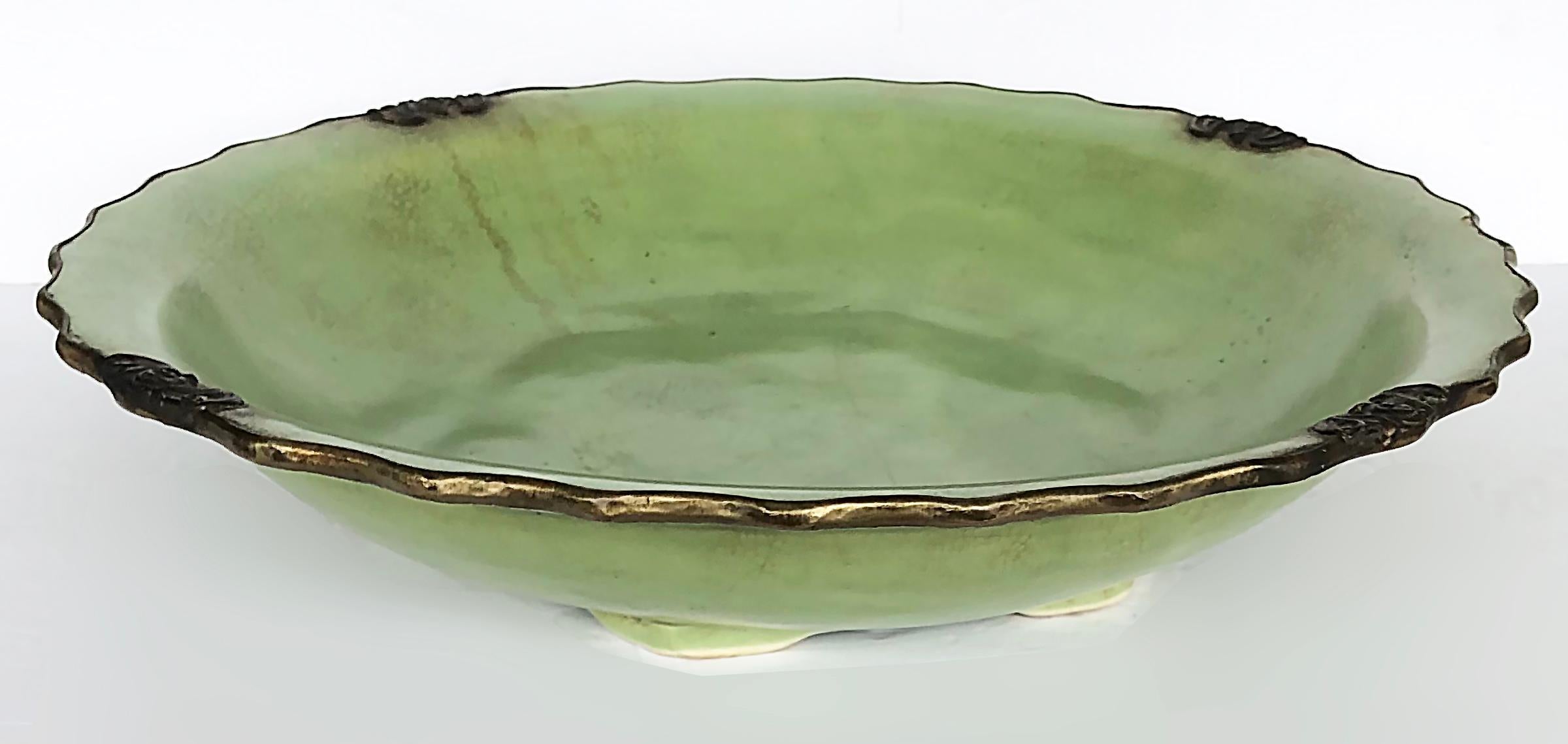Large John Richard Porcelain ceramic centerpiece bowl with crackle glaze

Offered for sale is a large modern celadon crackle glaze porcelain centerpiece from the John Richard Collection. The centerpiece bowl has intentional distressing with brown