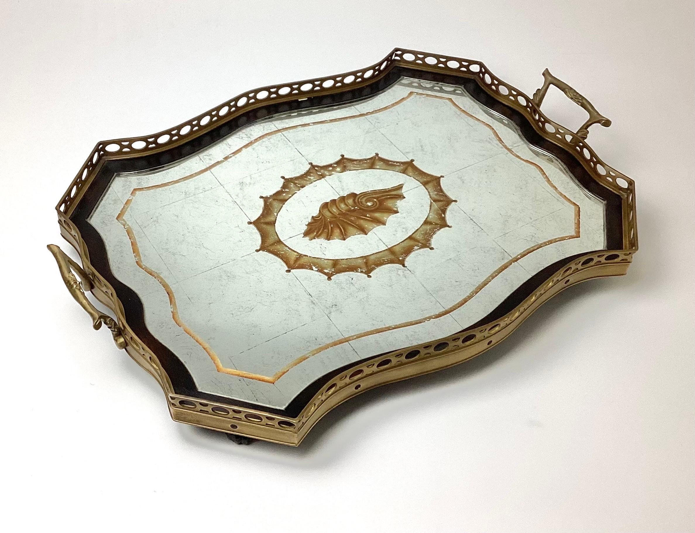 Large John Richard Silver Leaf Mirror and Brass Handled Frame Serving Tray with Painted Shell Center. This is a nice heavy tray, made very well with a distressed look to the mirror. Some minor age appropriate wear.